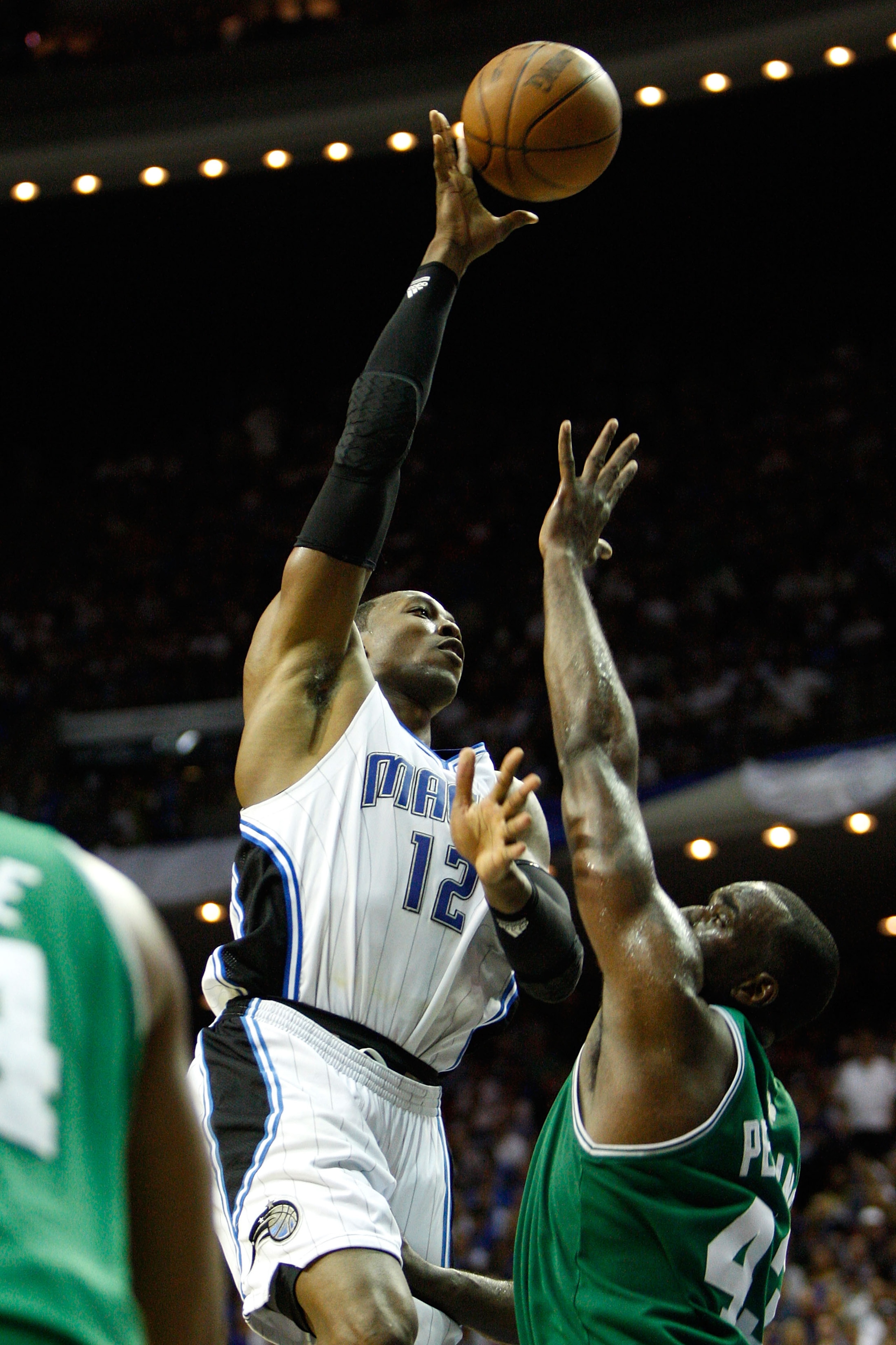 ORLANDO, FL - MAY 26:  Dwight Howard #12 of the Orlando Magic attempts a shot against Kendrick Perkins #43 of the Boston Celtics in Game Five of the Eastern Conference Finals during the 2010 NBA Playoffs at Amway Arena on May 26, 2010 in Orlando, Florida.