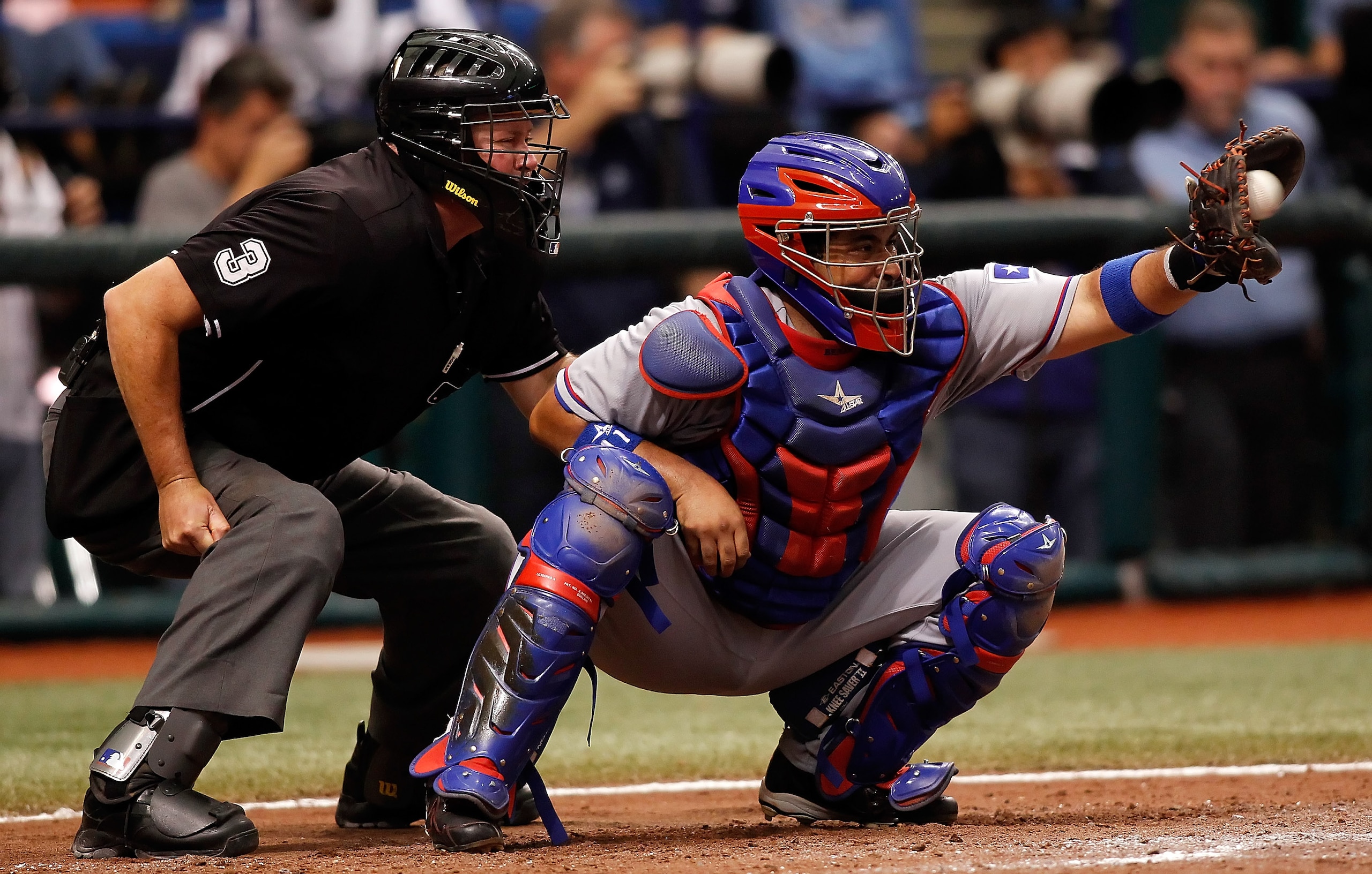 ST. PETERSBURG, FL - OCTOBER 06:  Catcher Bengie Molina #11 of the Texas Rangers catches against the Tampa Bay Rays during Game 1 of the ALDS at Tropicana Field on October 6, 2010 in St. Petersburg, Florida.  (Photo by J. Meric/Getty Images)