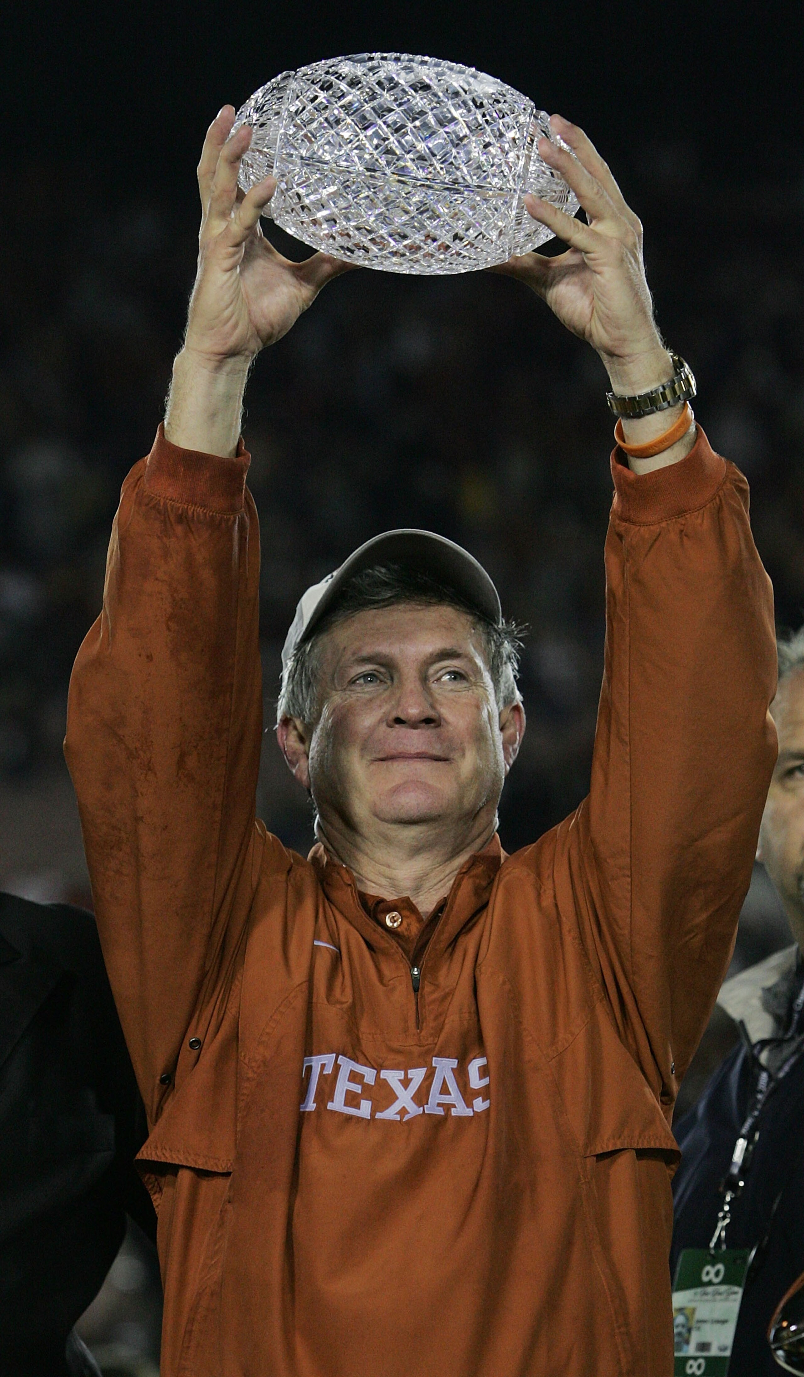 PASADENA, CA - JANUARY 04:  Head coach Mack Brown of the Texas Longhorns celebrates with the National Championship trophy after defeating the USC Trojans 41-38 to win the BCS National Championship Rose Bowl Game on January 4, 2006 in Pasadena, California.