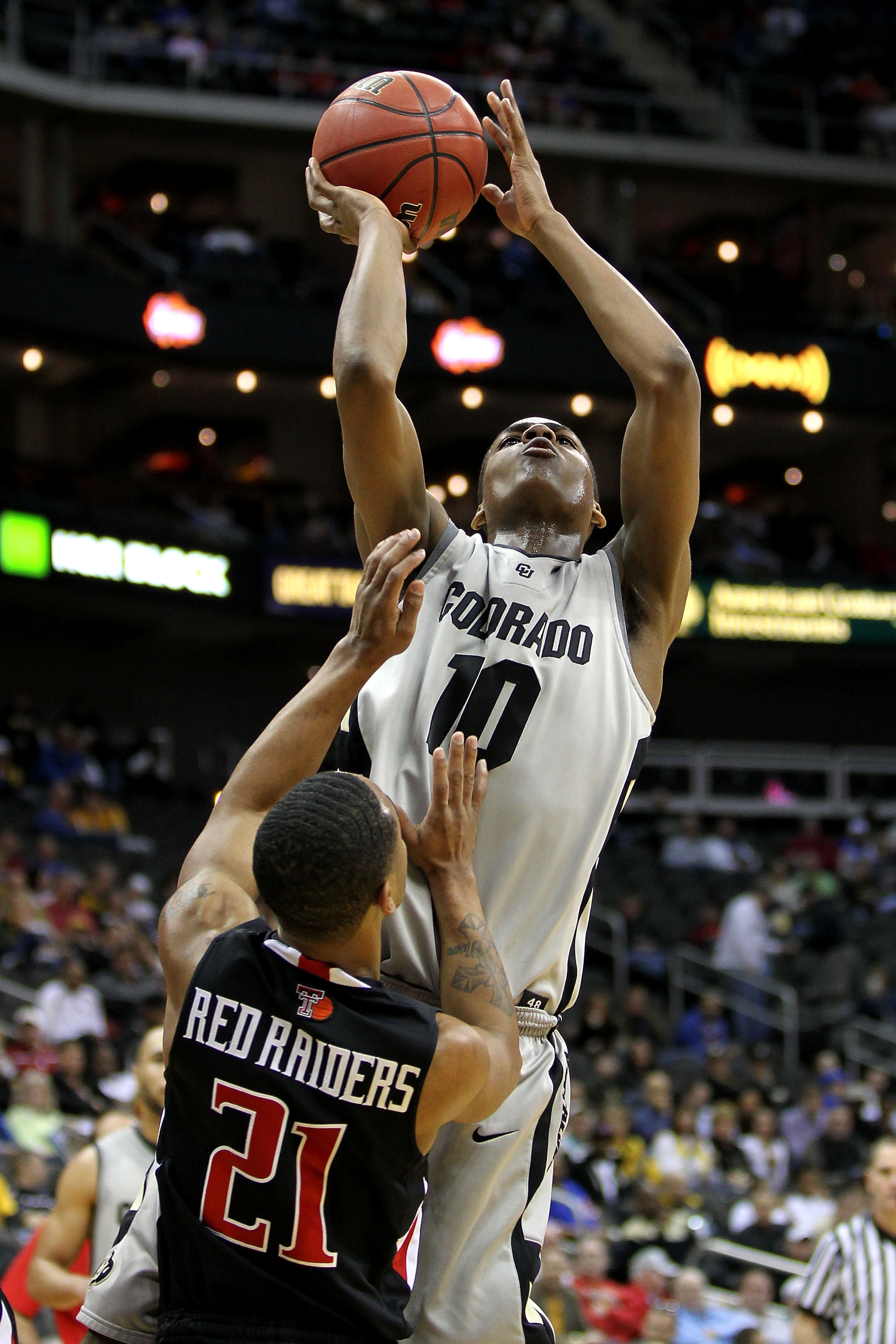 KANSAS CITY, MO - MARCH 10:  Alec Burks #10 of the Colorado Buffaloes shoots the ball over John Roberson #21 of  the Texas Tech Red Raiders in the first half during the first round game of the 2010 Phillips 66 Big 12 Men's Basketball Tournament at the Spr
