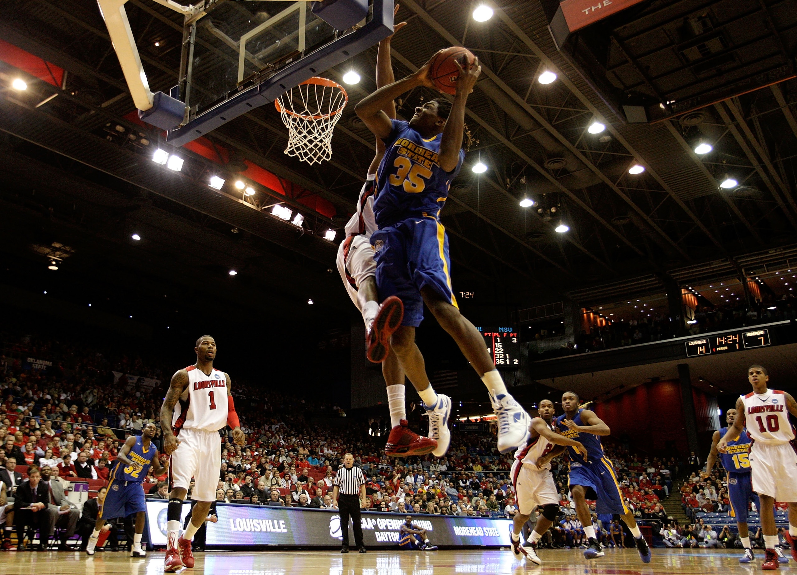 DAYTON, OH - MARCH 20:  Kenneth Faried #35 of the Morehead State Eagles drives to the hoop against George Goode #22 of the Louisville Cardinals during the first round of the NCAA Division I Men's Basketball Tournament at the University of Dayton Arena on