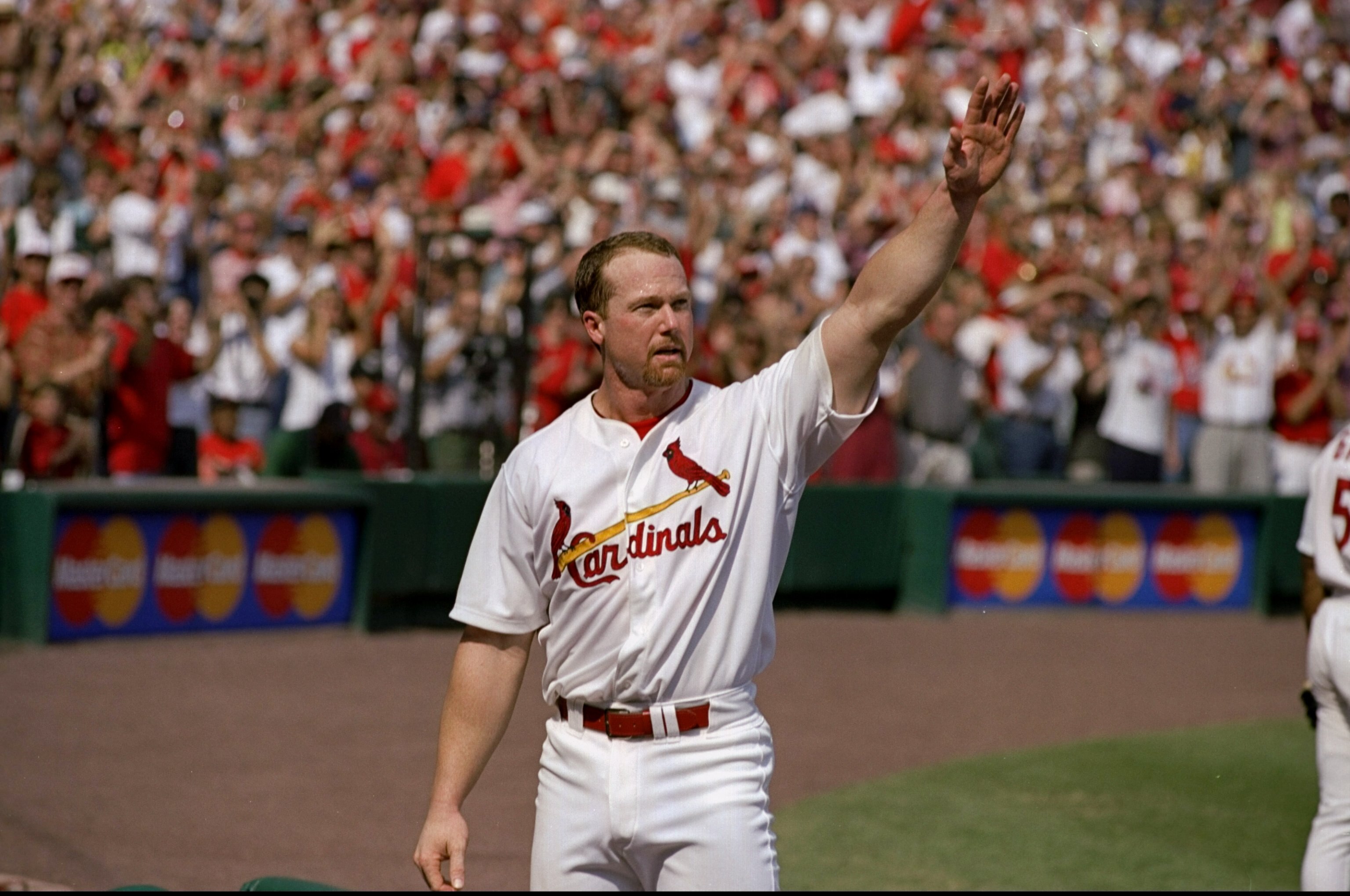 27 Sep 1998:  Mark McGwire #25 of the St. Louis Cardinals acknowledges the fans after hitting his 70th home run of the season during a game against the Montreal Expos at the Busch Stadium in St. Louis, Missouri. The Cardinals defeated the Expos 6-3.