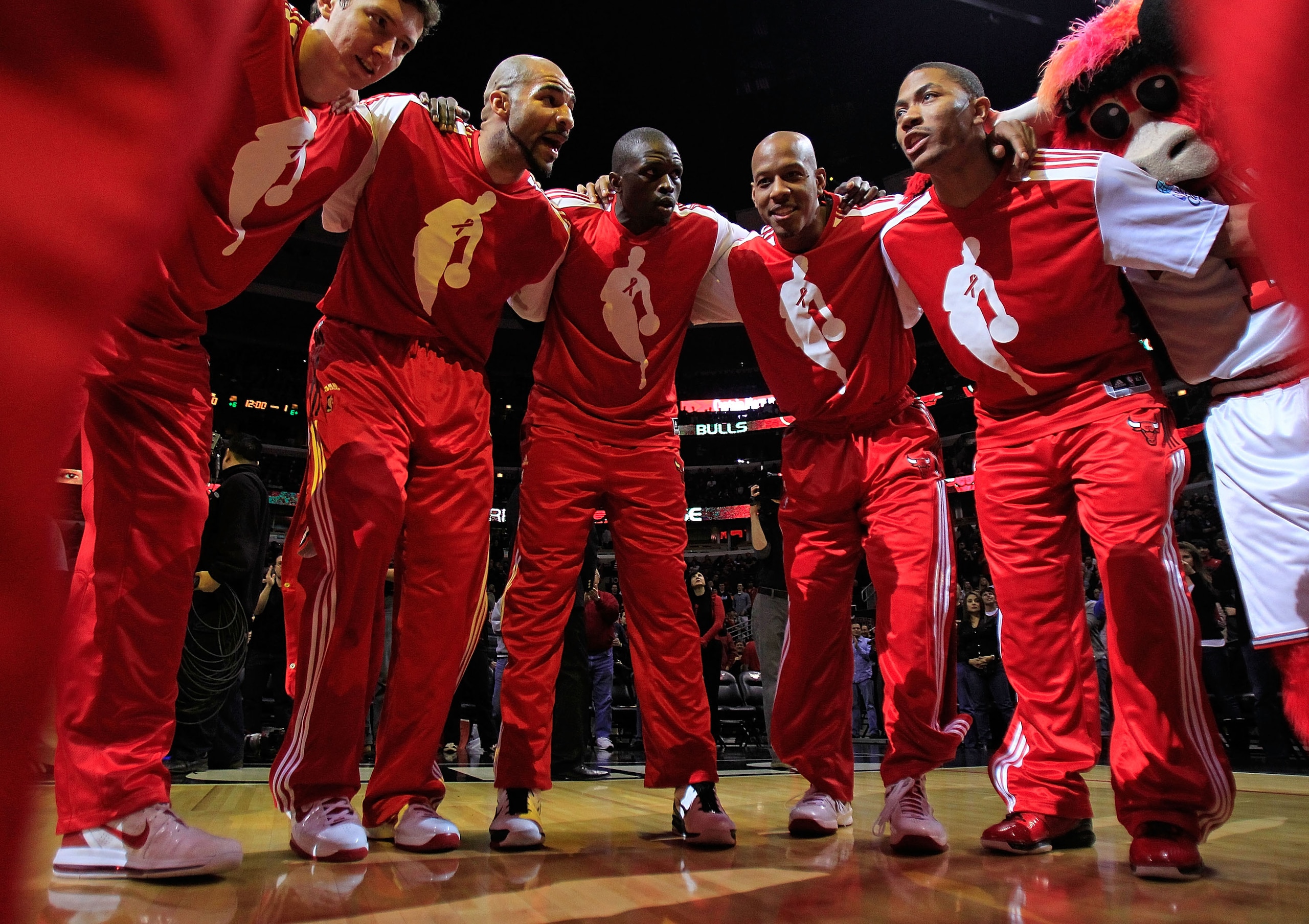 CHICAGO, IL - DECEMBER 01: (L-R) Omer Asik #3, Carlos Boozer #5, Loul Deng #9, Keith Bogans #6 and Derrick Rose #1 of the Chicago Bulls gather in a huddle after player introductions before a game against the Orlando Magic at the United Center on December
