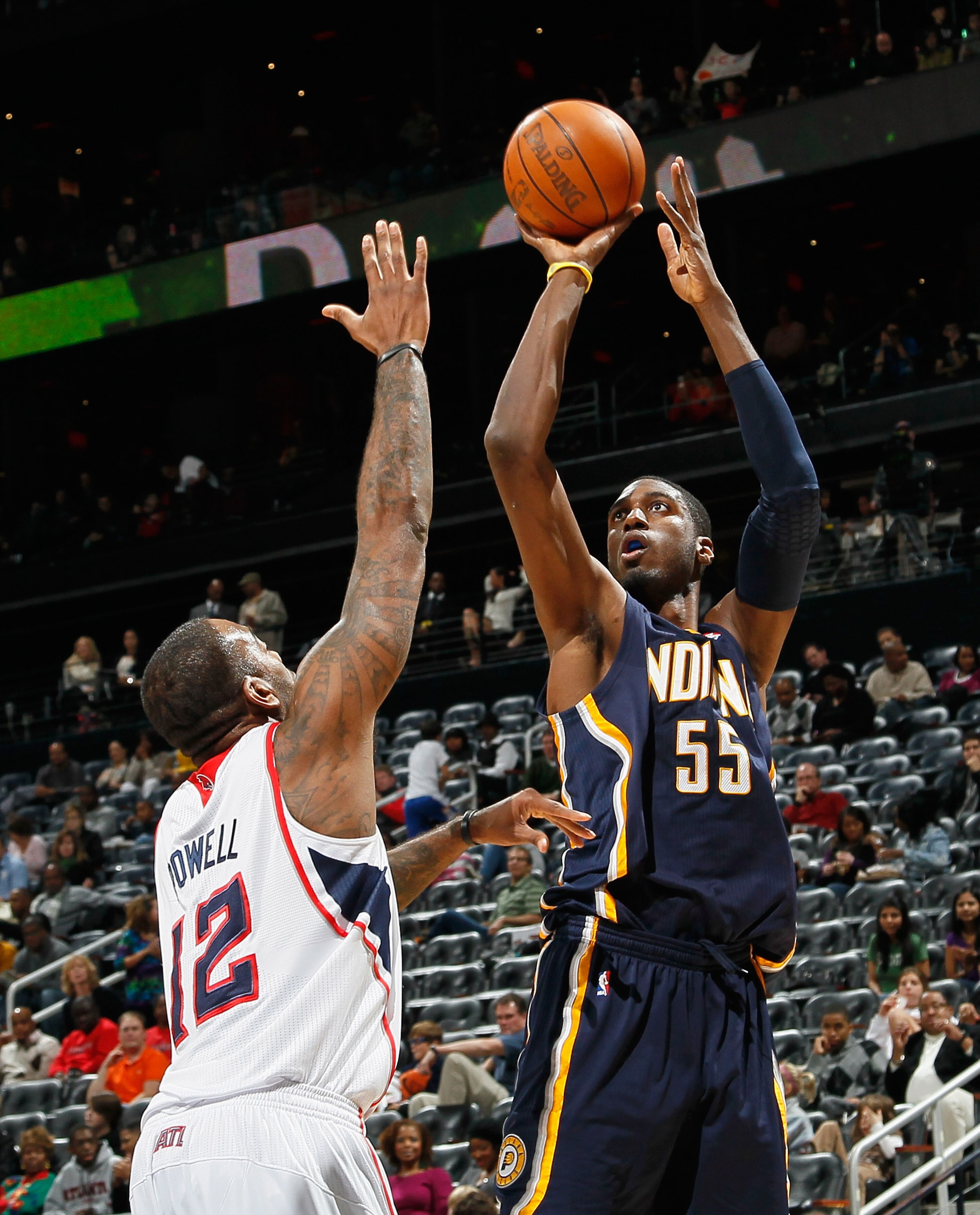 ATLANTA, GA - DECEMBER 11: Roy Hibbert #55 of the Indiana Pacers against Josh Powell #12 of the Atlanta Hawks at Philips Arena on December 11, 2010 in Atlanta, Georgia. NOTE TO USER: User expressly acknowledges and agrees that, by downloading and/or usi ATLANTA, GA - DECEMBER 11: Roy Hibbert #55 of the Indiana Pacers against Josh Powell #12 of the Atlanta Hawks at Philips Arena on December 11, 2010 in Atlanta, Georgia. NOTE TO USER: User expressly acknowledges and agrees that, by downloading and/or usi