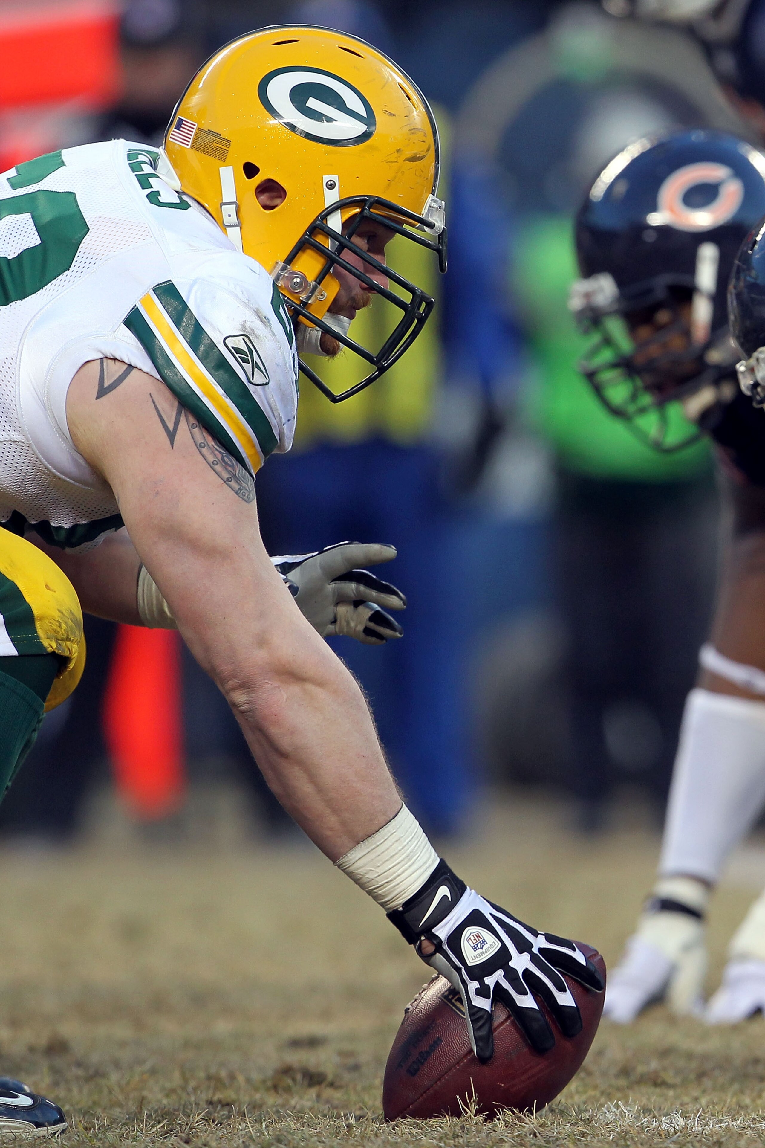 CHICAGO, IL - JANUARY 23:  Center Scott Wells #63 of the Green Bay Packers prepares to snap the ball against the Chicago Bears in the NFC Championship Game at Soldier Field on January 23, 2011 in Chicago, Illinois.  (Photo by Jamie Squire/Getty Images)