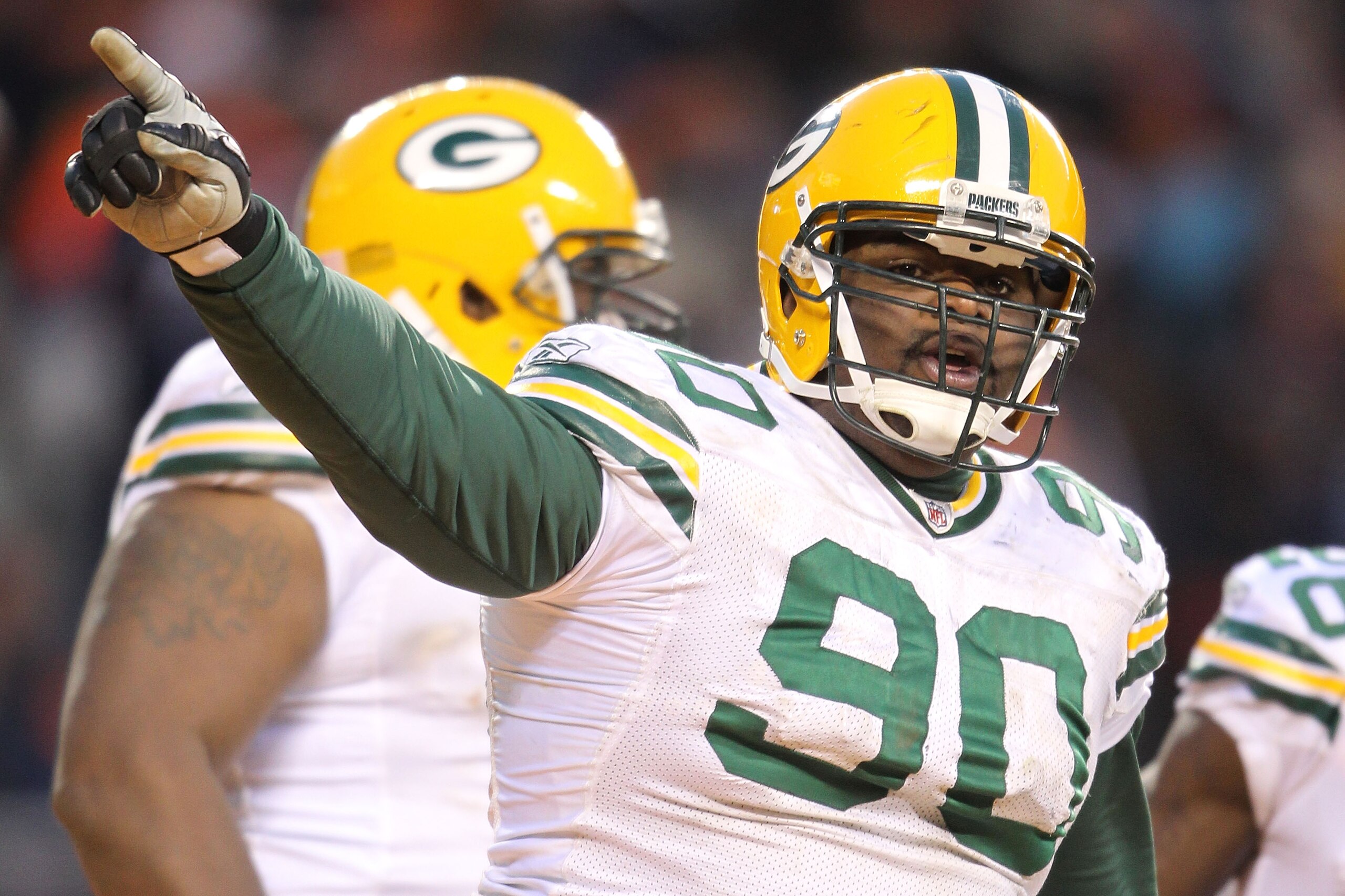 CHICAGO, IL - JANUARY 23:  B.J. Raji #90 of the Green Bay Packers reacts after scoring on a 18-yard interception return for a touchdown in the fourth quarter against the Chicago Bears in the NFC Championship Game at Soldier Field on January 23, 2011 in Ch