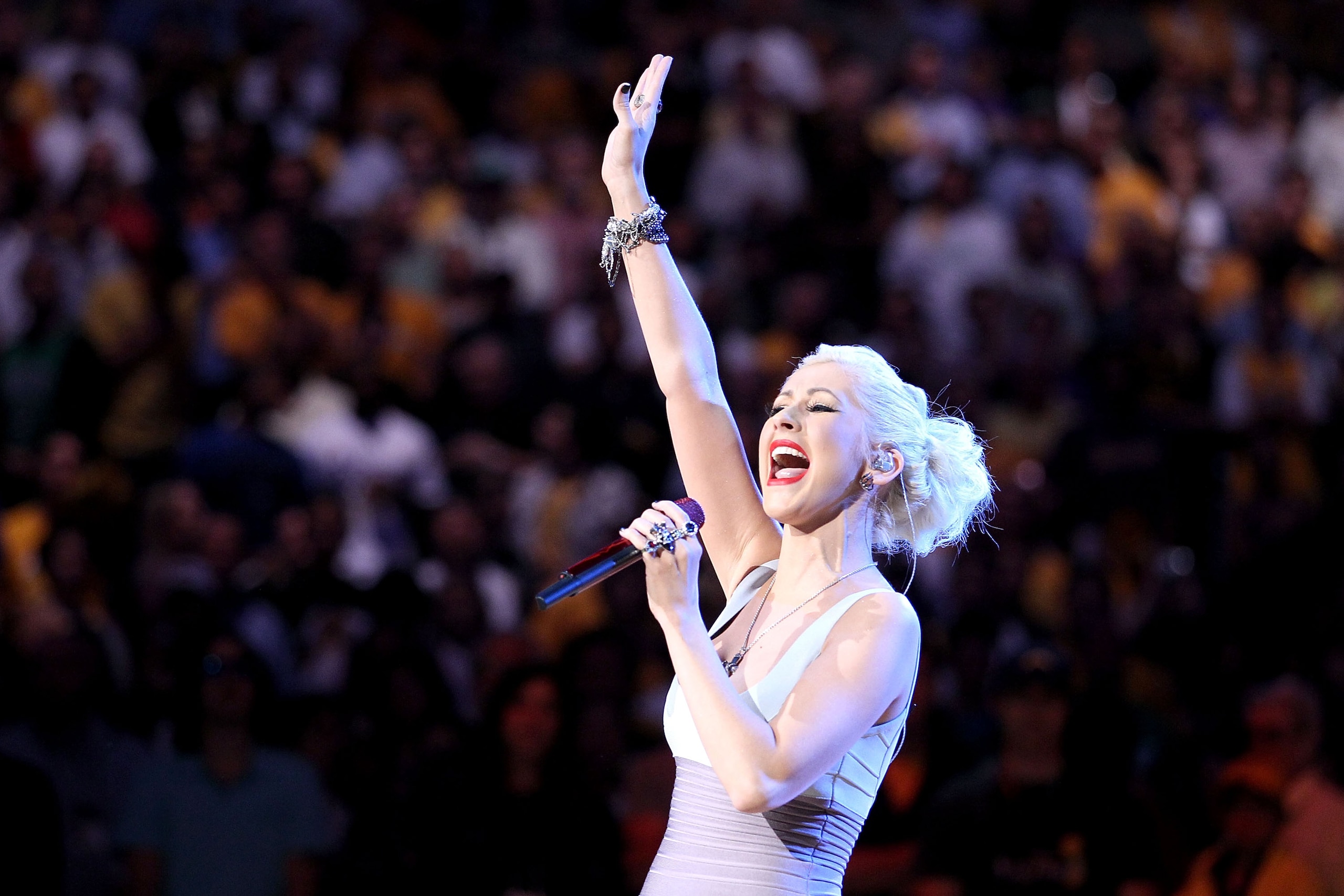 LOS ANGELES, CA - JUNE 17:  Singer Christina Aguilera performs the national anthem before Game Seven of the 2010 NBA Finals at Staples Center between the Boston Celtics and the Los Angeles Lakers on June 17, 2010 in Los Angeles, California.  NOTE TO USER: