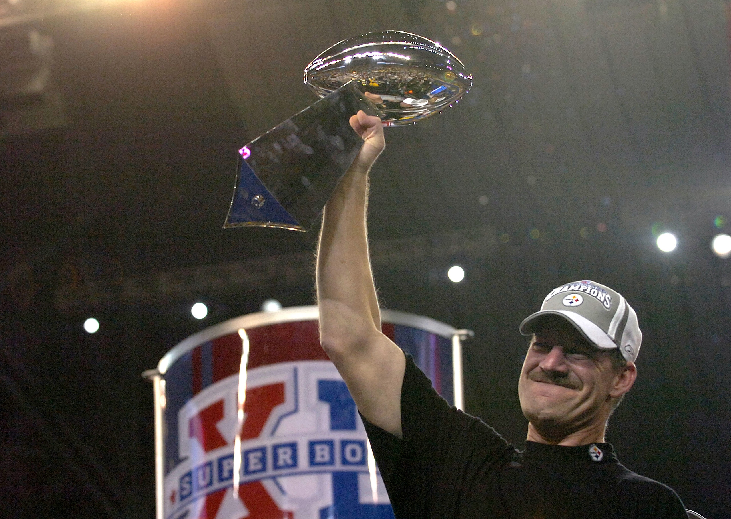 Steelers head coach Bill Cowher holds the Vince Lombardi trophy after the Steelers won Super Bowl XL between the Pittsburgh Steelers and Seattle Seahawks at Ford Field in Detroit, Michigan on February 5, 2006.  (Photo by Al Messerschmidt/Getty Images)