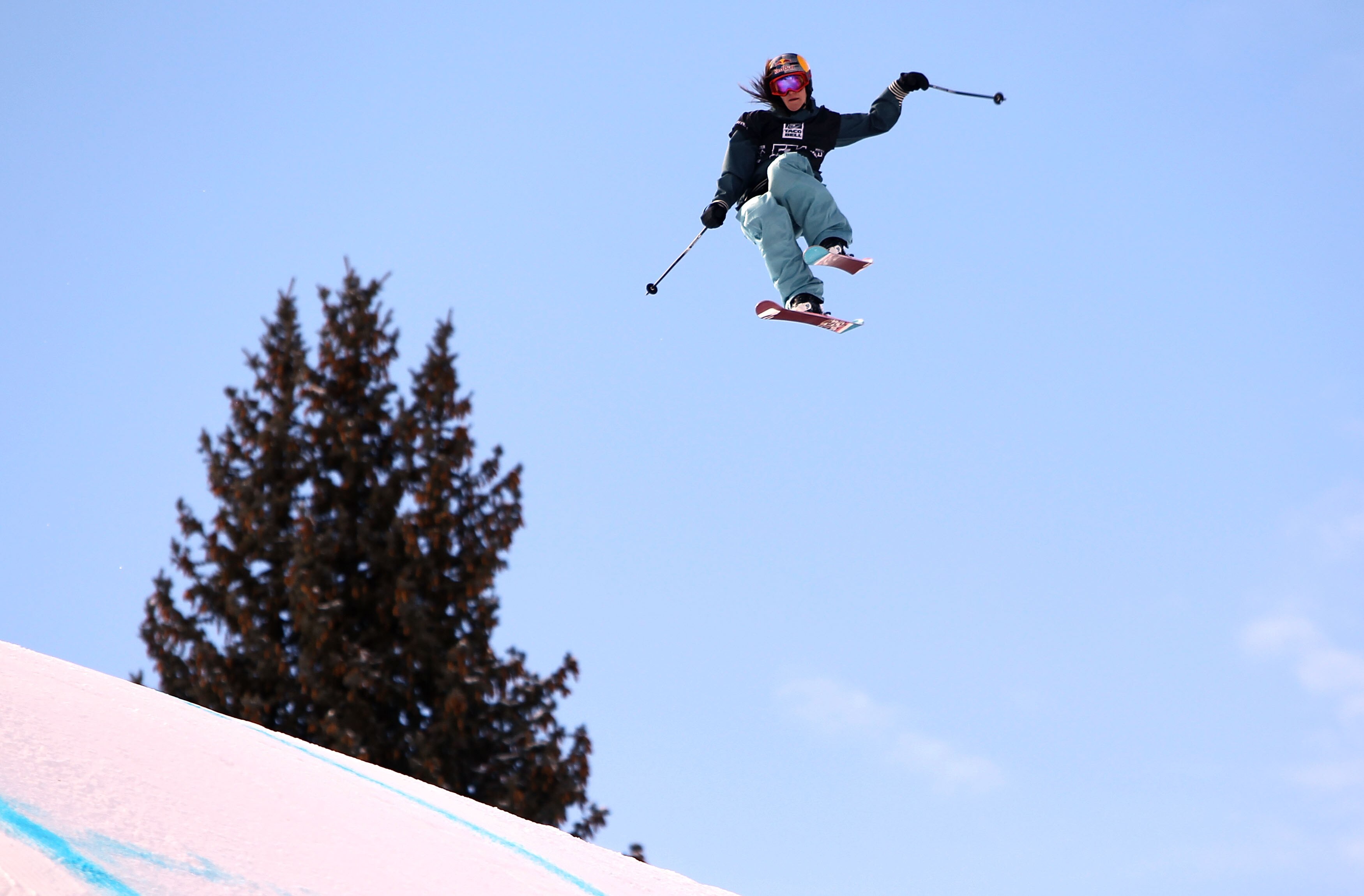 ASPEN, CO - JANUARY 28:  Kaya Turski of Canada does an aerial maneuver as she descends the course to win the Women's Skiing Slopestyle Finals during Winter X Games 14 at Buttermilk Mountain on January 28, 2010 in Aspen, Colorado.  (Photo by Doug Pensinger