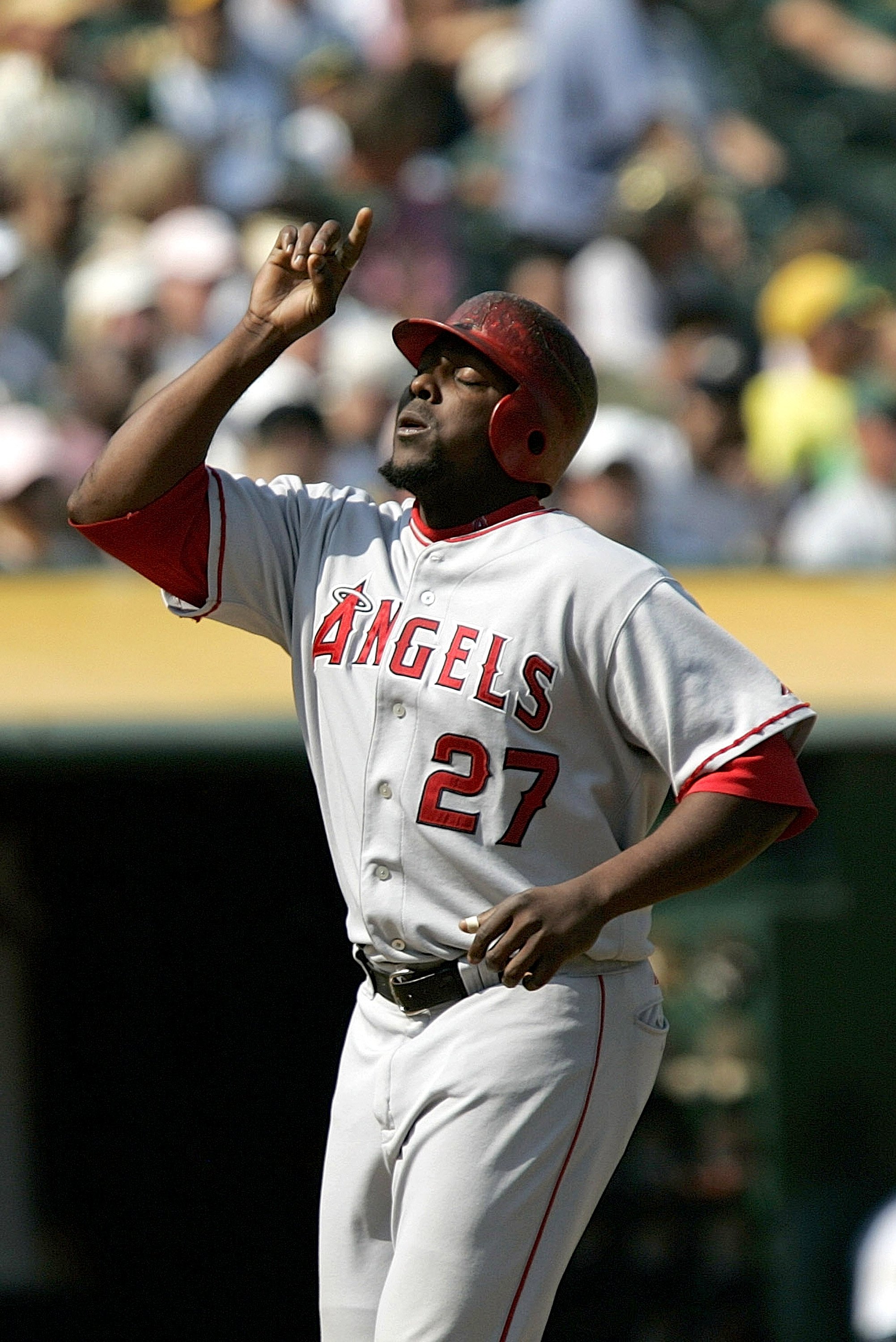 ANAHEIM, CA - AUGUST 10: Former Los Angeles Angels outfielder Vladimir  Guerrero on the field next to his Baseball Hall of Fame plaque as Guerrero  is honored for becoming the first player