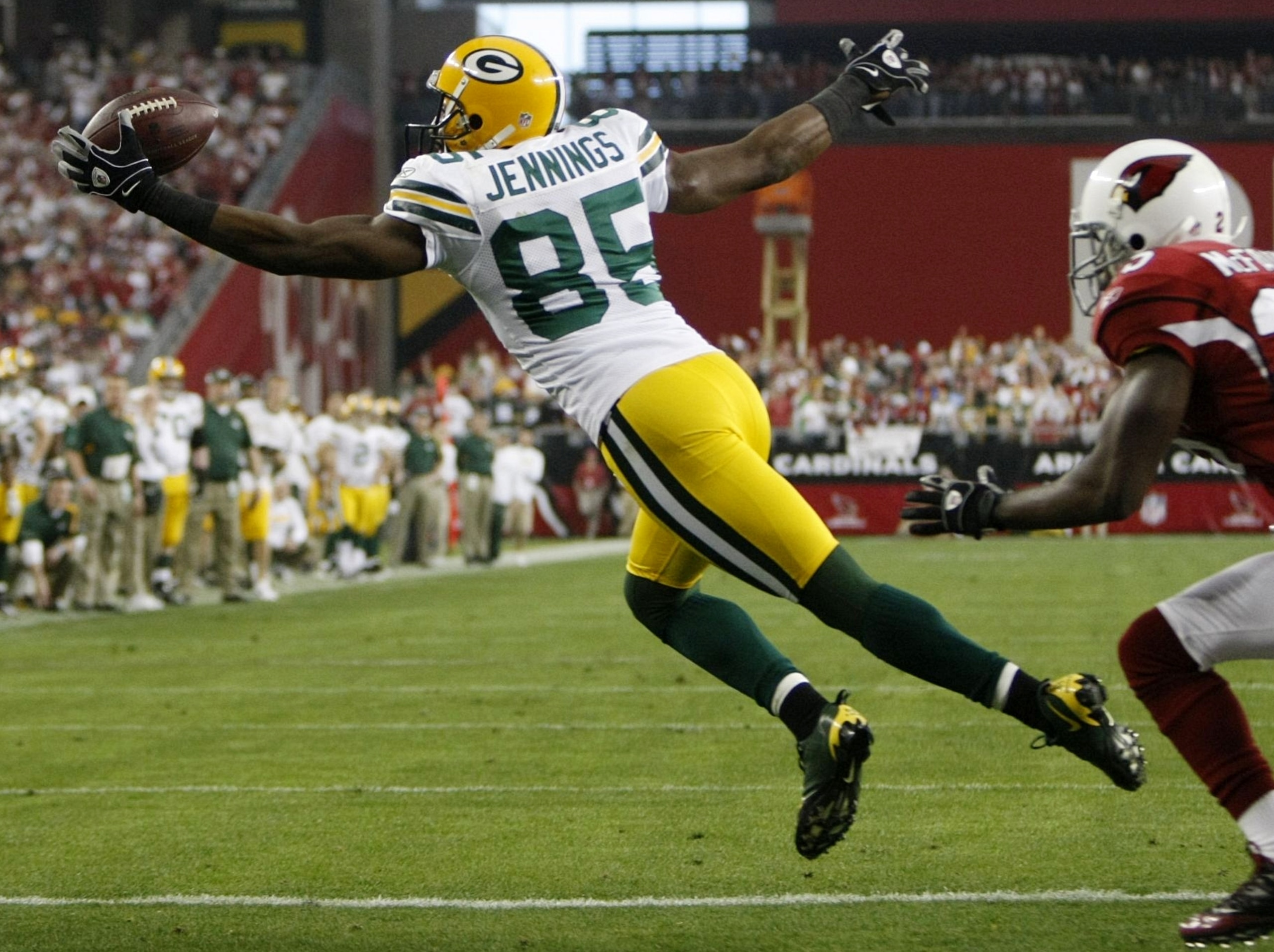 GLENDALE, AZ - JANUARY 10: Wide receiver Greg Jennings #85 of the Green Bay Packers catches the ball for a touchdown against the Arizona Cardinals during the third quarter of the 2010 NFC wild-card playoff game at University of Phoenix Stadium on January GLENDALE, AZ - JANUARY 10: Wide receiver Greg Jennings #85 of the Green Bay Packers catches the ball for a touchdown against the Arizona Cardinals during the third quarter of the 2010 NFC wild-card playoff game at University of Phoenix Stadium on January