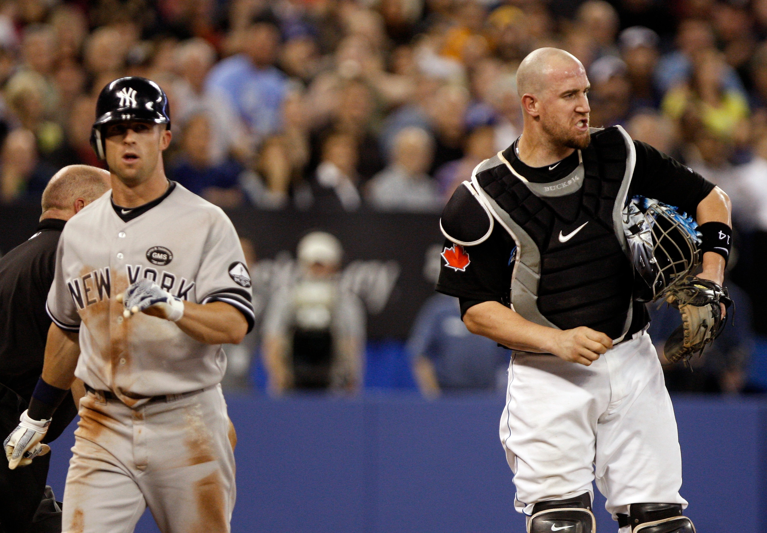 TORONTO, ON - SEPTEMBER 28: John Buck #14 of the Toronto Blue Jays reacts as Brett Gardner #11 of the New York Yankees is called safe at home during an MLB game at the Rogers Centre September 28, 2010 in Toronto, Ontario, Canada. (Photo by Abelimages/Gett TORONTO, ON - SEPTEMBER 28: John Buck #14 of the Toronto Blue Jays reacts as Brett Gardner #11 of the New York Yankees is called safe at home during an MLB game at the Rogers Centre September 28, 2010 in Toronto, Ontario, Canada. (Photo by Abelimages/Gett