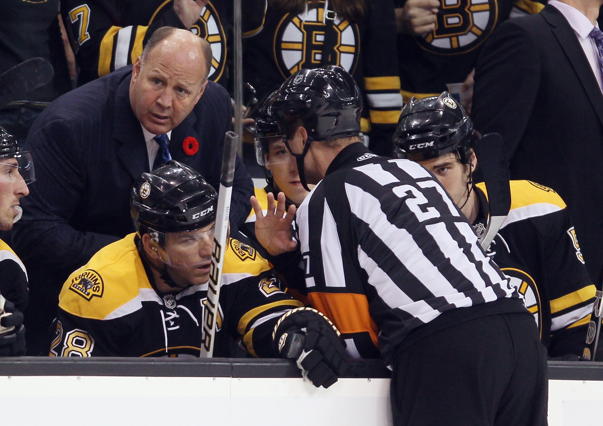 BOSTON - NOVEMBER 06: Head coach Claude Julien of the Boston Bruins speaks with referee Craig Furlatt #27 after a goal in the second period by the Bruins was reviewed and cancelled against the St. Louis Blues on November 6, 2010 at the TD Garden in Boston