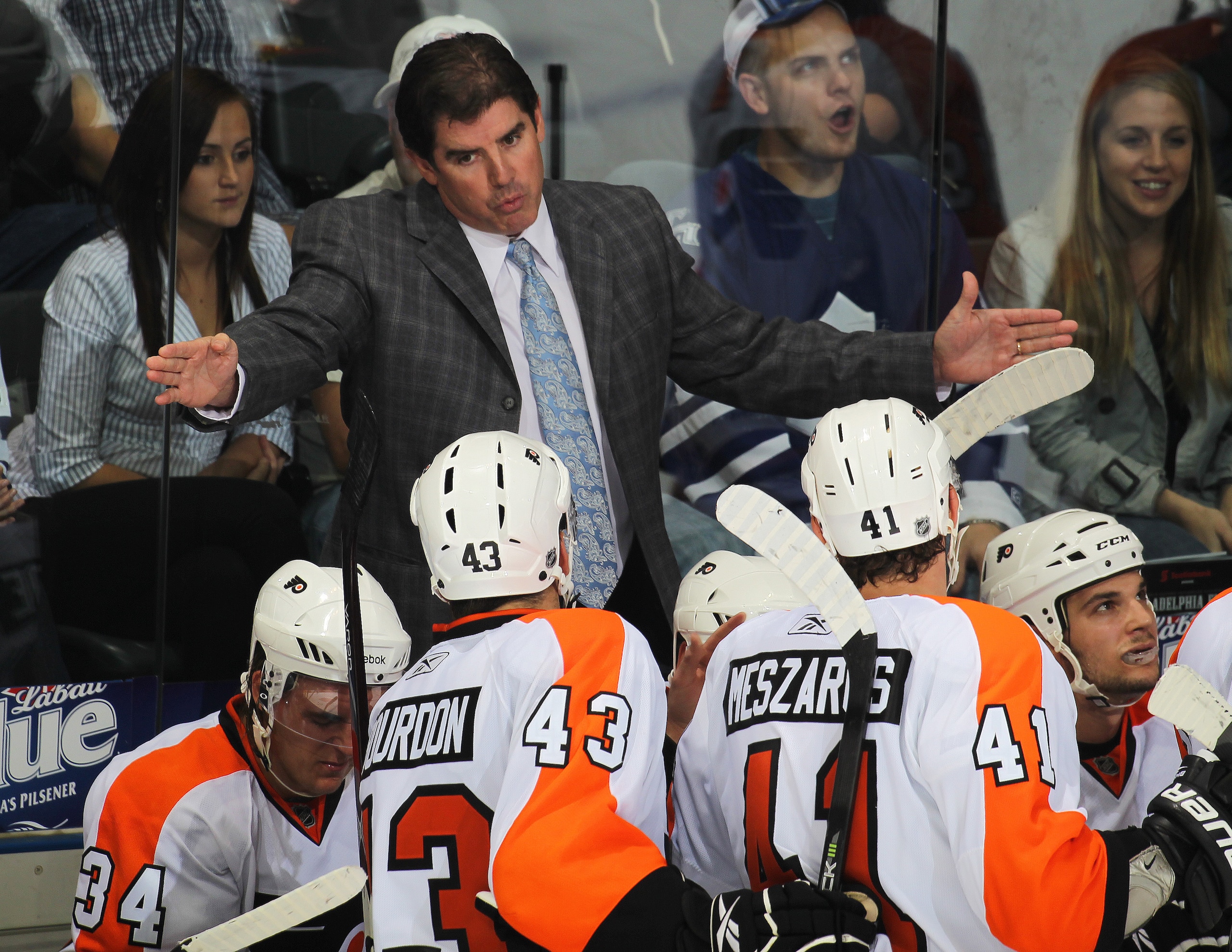 LONDON,ON - SEPTEMBER 23: Head coach Peter Laviolette of the Philadelphia Flyers gives instructions prior to a shootout in a pre-season game against the Toronto Maple Leafs on September 23,2010 at the John Labatt Centre in London, Ontario. The Leafs defea