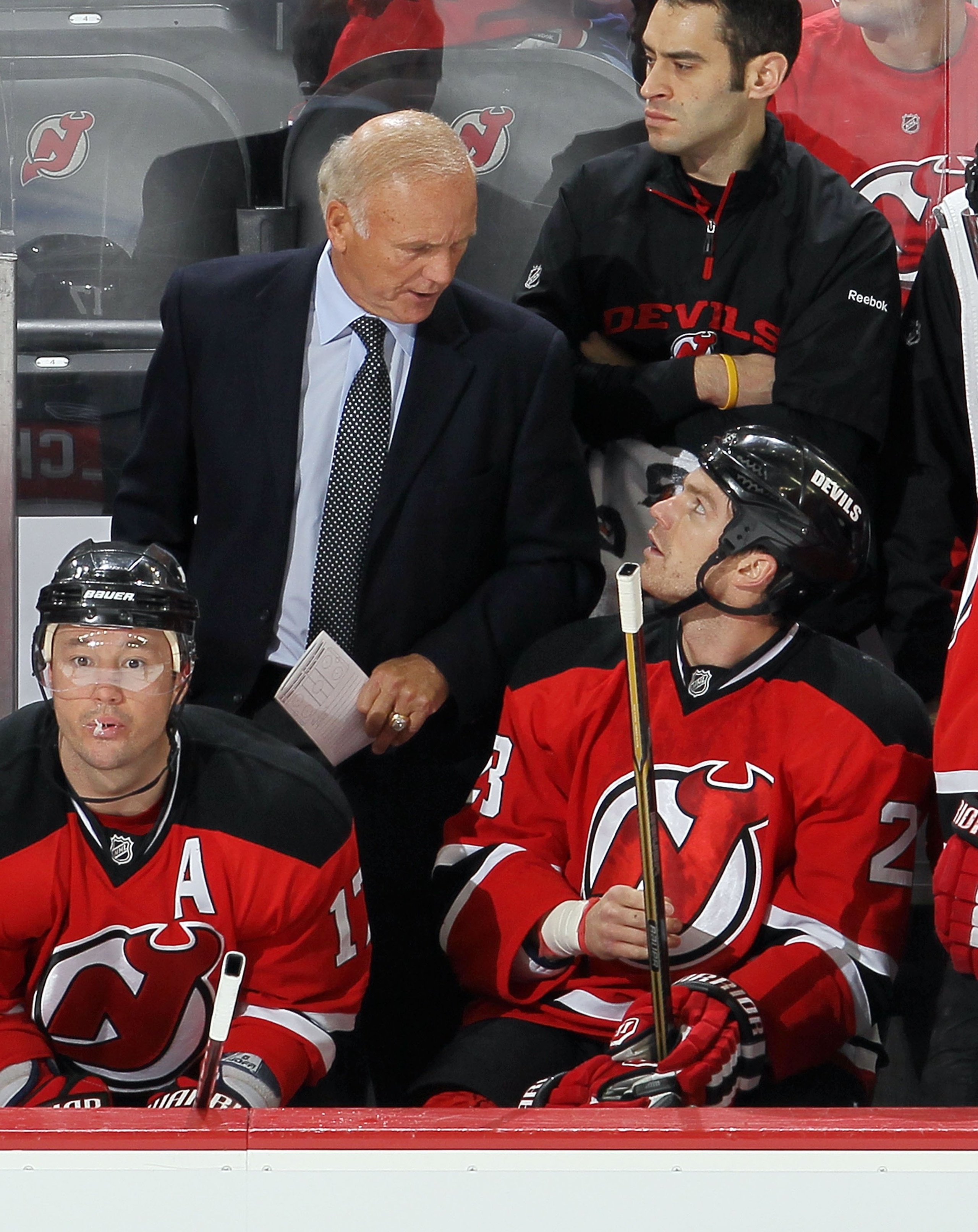 NEWARK, NJ - DECEMBER 23:  Head coach Jacques Lemaire of the New Jersey Devils looks on against the New York Islanders at the Prudential Center on December 23, 2010 in Newark, New Jersey.  (Photo by Jim McIsaac/Getty Images)
