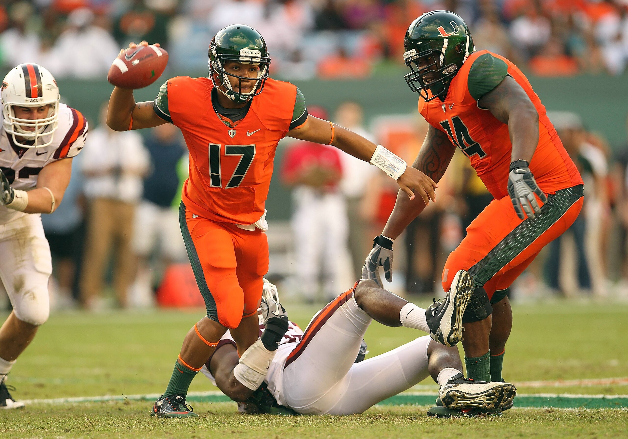 MIAMI - NOVEMBER 20:  Stephen Morris #17 of the Miami Hurricanes passes out of trouble during a game against the Virginia Tech Hokies at Sun Life Stadium on November 20, 2010 in Miami, Florida.  (Photo by Mike Ehrmann/Getty Images)