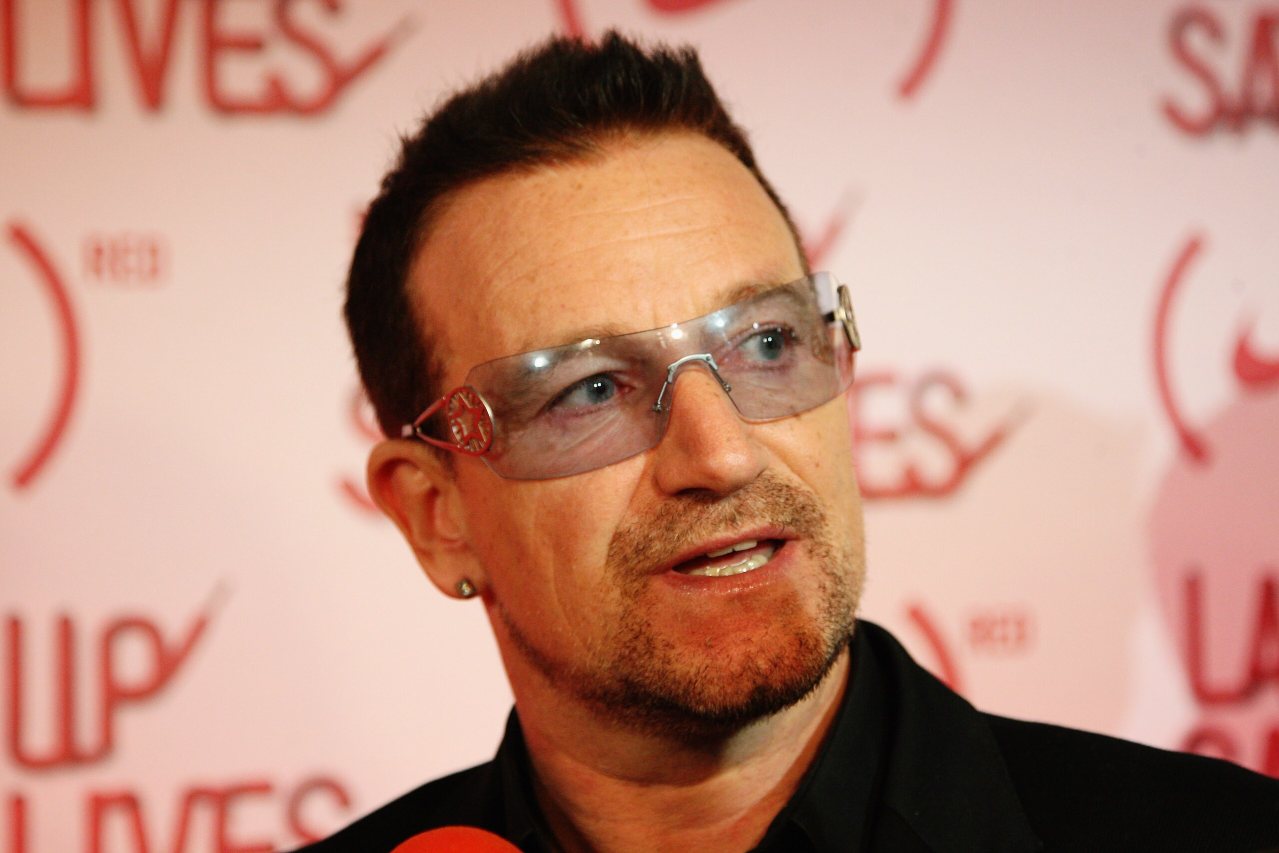 LONDON, ENGLAND - NOVEMBER 30:  Musician Bono attends the NIKE & (RED) Charity Announcement at NikeTown on November 30, 2009 in London, England. On the day before World Aids day some of the world's best footballers joined Bono at an announcement of the pa