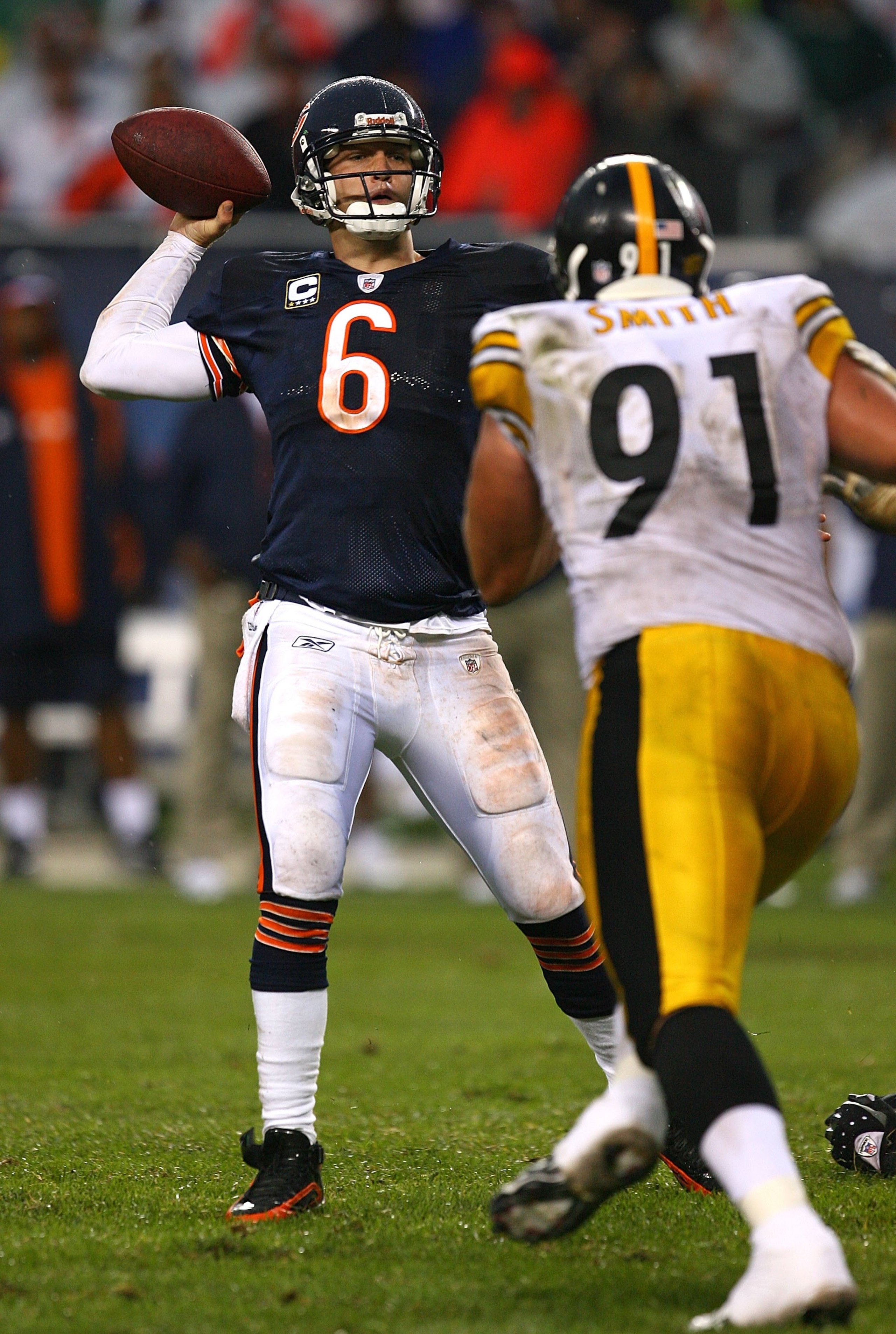 CHICAGO - SEPTEMBER 20: Jay Cutler #6 of the Chicago Bears passes the ball under pressure from Aaron Smith #91 of the Pittsburgh Steelers at Soldier Field on September 20, 2009 in Chicago, Illinois. The Bears defeated the Steelers 17-14. (Photo by Jonatha