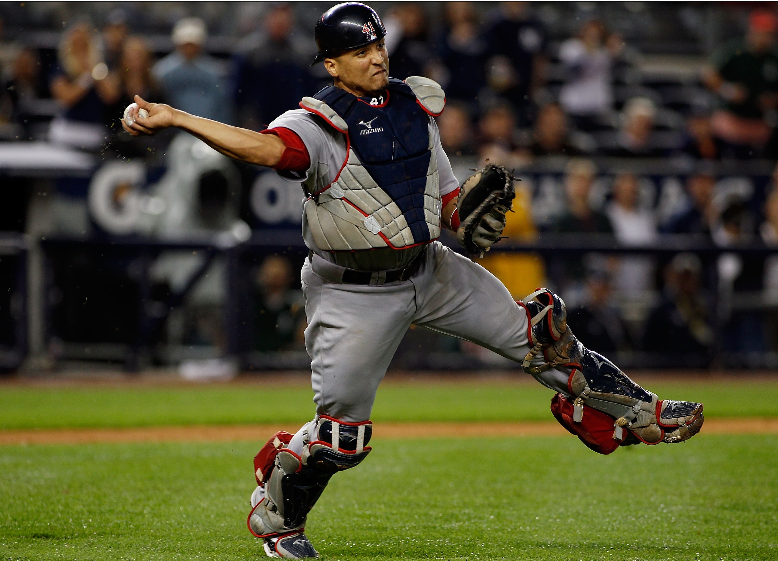 NEW YORK - SEPTEMBER 26: Victor Martinez #41 of the Boston Red Sox throws the ball away for an error on Brett Gardner (not shown) of the New York Yankees bunt attempt in the 10th inning on September 26, 2010 at Yankee Stadium in the Bronx borough of New NEW YORK - SEPTEMBER 26: Victor Martinez #41 of the Boston Red Sox throws the ball away for an error on Brett Gardner (not shown) of the New York Yankees bunt attempt in the 10th inning on September 26, 2010 at Yankee Stadium in the Bronx borough of New