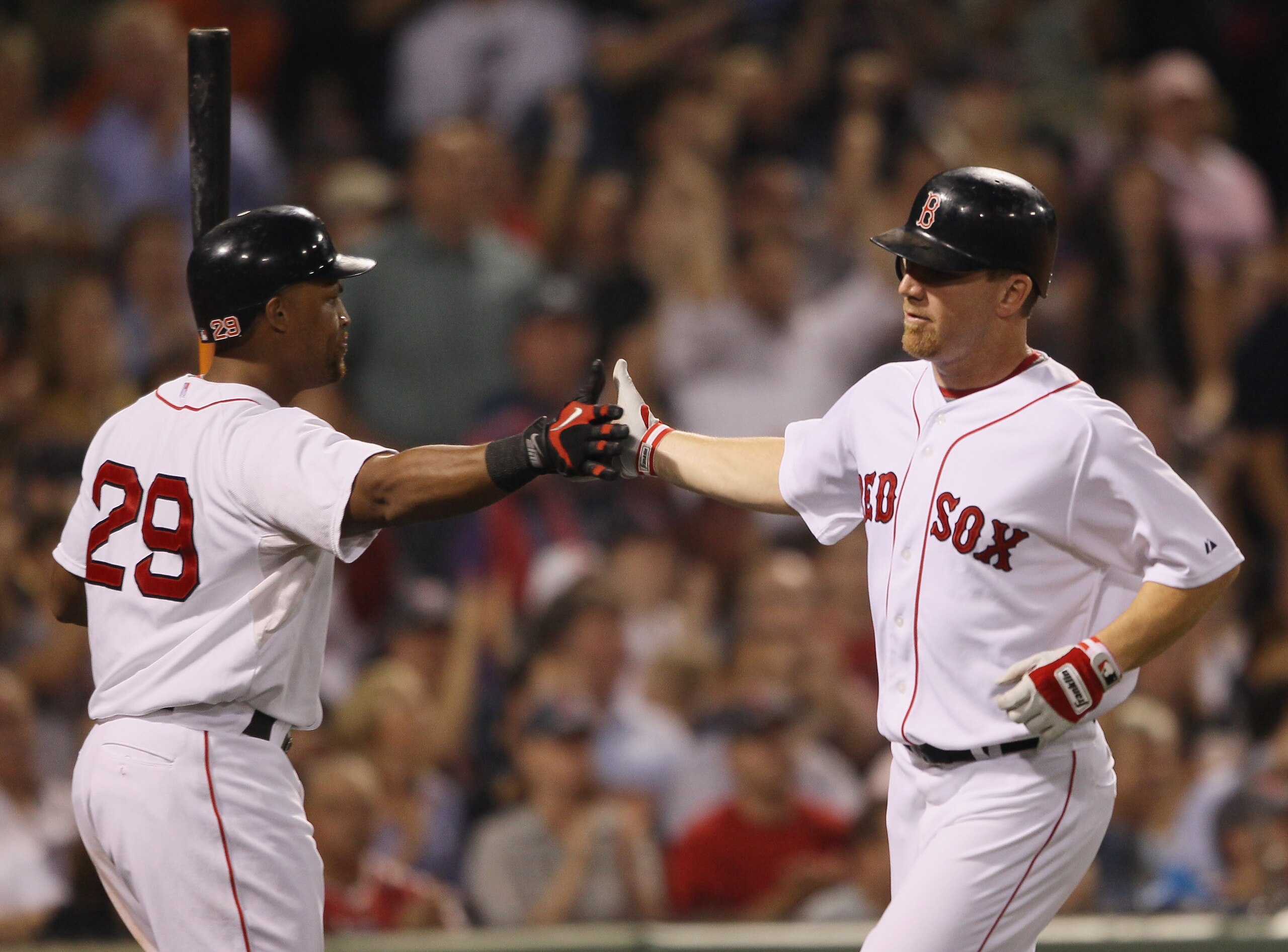 BOSTON - SEPTEMBER 22: J.D. Drew #7 of the Boston Red Sox is congratulated by teammate Adrian Beltre #29 after Drew scored on a single from David Oritz in the sixth inning against the Baltimore Orioles on September 22, 2010 at Fenway Park in Boston, Mass BOSTON - SEPTEMBER 22: J.D. Drew #7 of the Boston Red Sox is congratulated by teammate Adrian Beltre #29 after Drew scored on a single from David Oritz in the sixth inning against the Baltimore Orioles on September 22, 2010 at Fenway Park in Boston, Mass