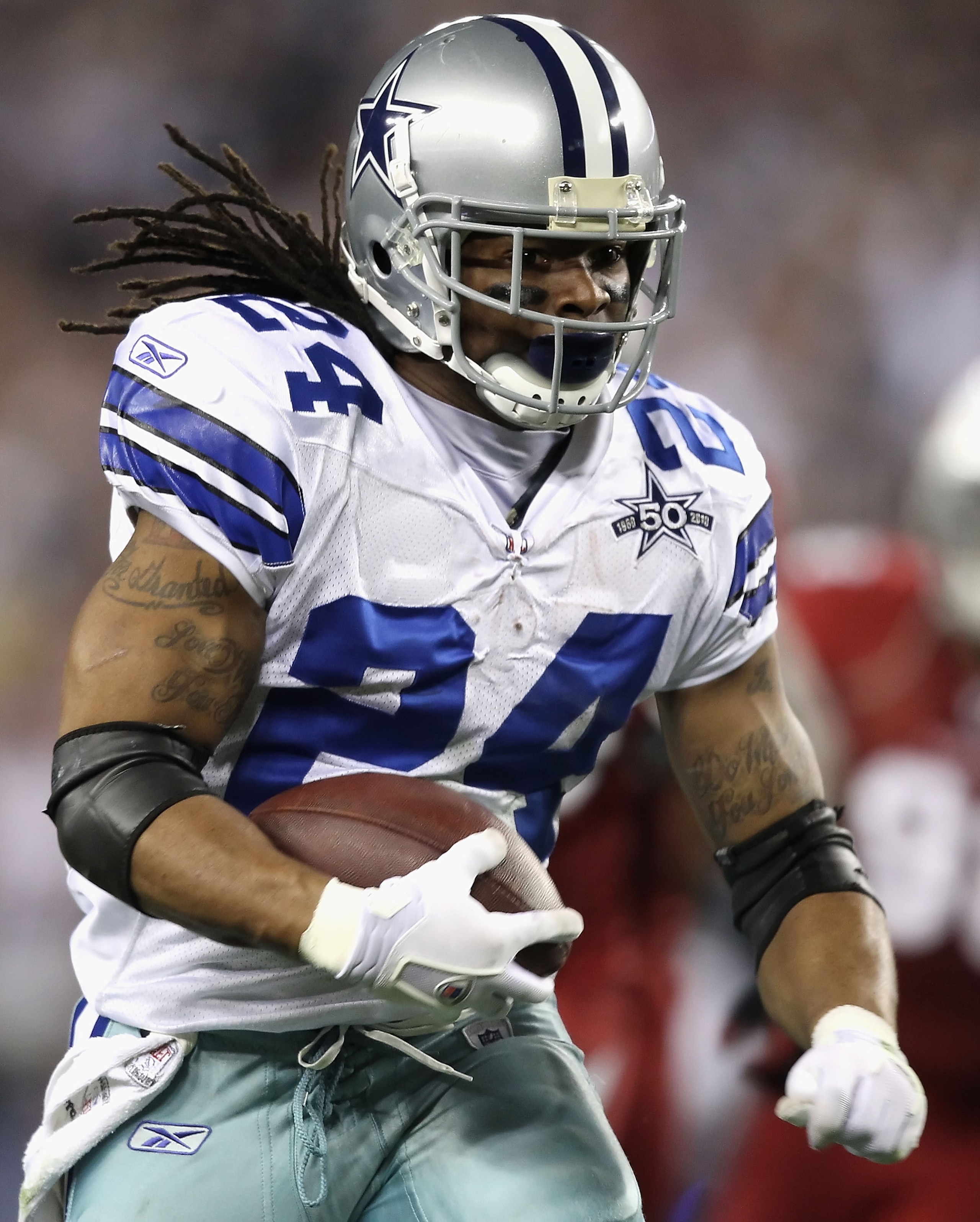 GLENDALE, AZ - DECEMBER 25: Runningback Marion Barber #24 of the Dallas Cowboys rushes the football during the NFL game against the Arizona Cardinals at the University of Phoenix Stadium on December 25, 2010 in Glendale, Arizona. The Cardinals defeated GLENDALE, AZ - DECEMBER 25: Runningback Marion Barber #24 of the Dallas Cowboys rushes the football during the NFL game against the Arizona Cardinals at the University of Phoenix Stadium on December 25, 2010 in Glendale, Arizona. The Cardinals defeated