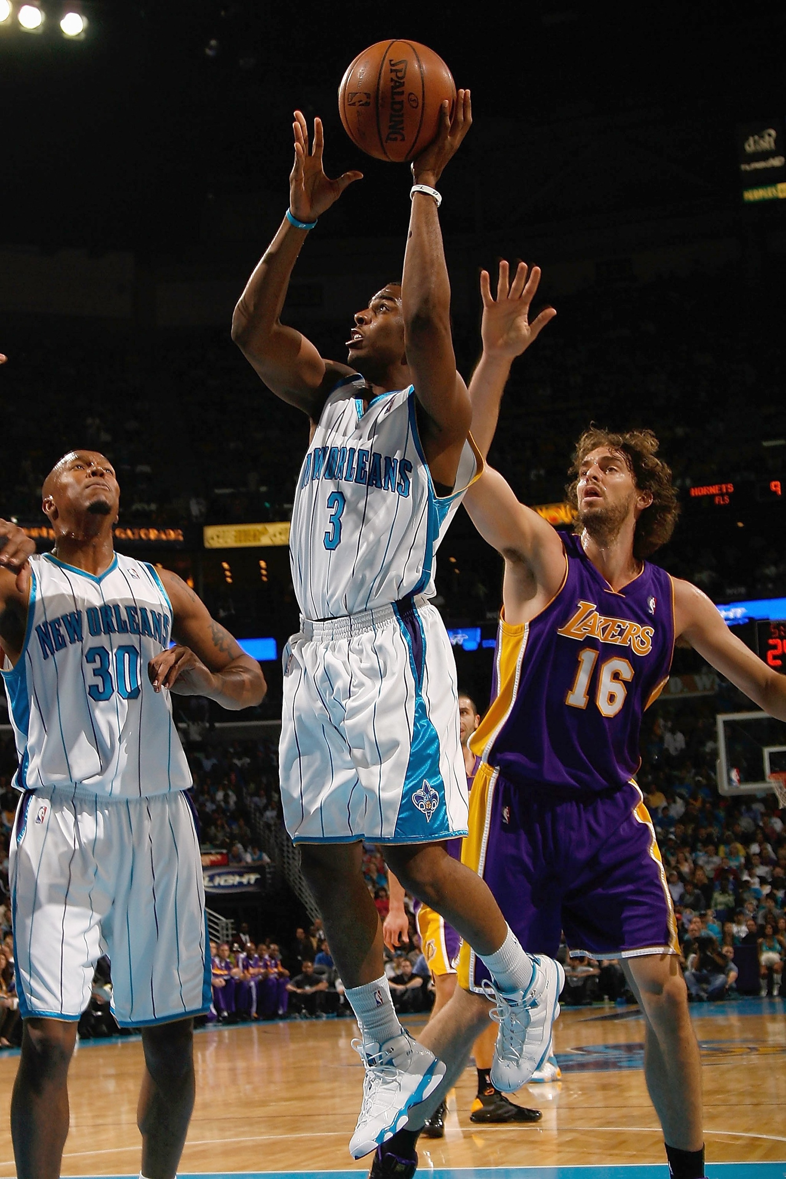 NEW ORLEANS - NOVEMBER 12:  Chris Paul #3 of the New Orleans Hornets looks to shoot against Pau Gasol #16 of the Los Angeles Lakers at the New Orleans Arena on November 12, 2008 in New Orleans, Louisiana. The Lakers won 93-86. NOTE TO USER: User expressly