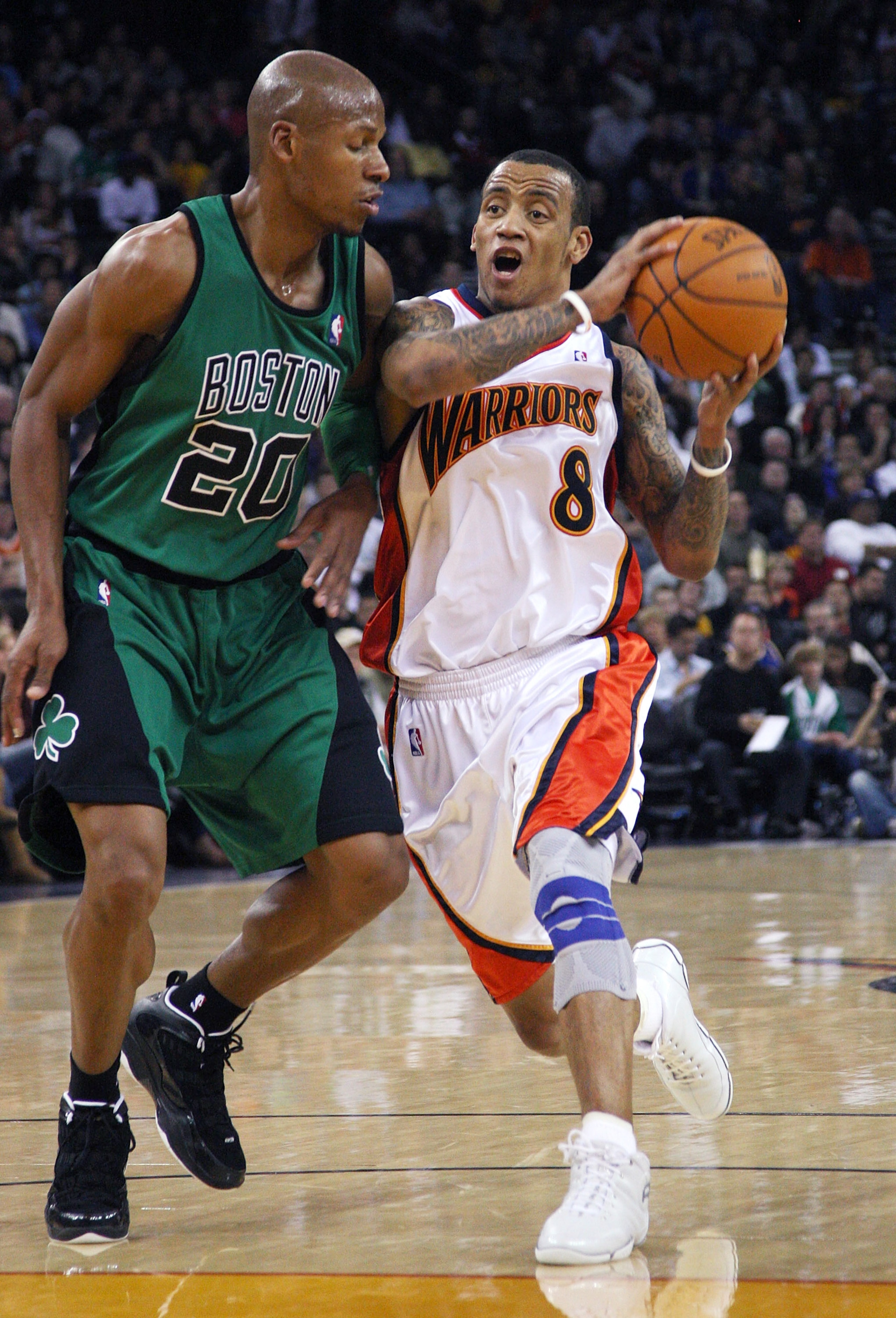 OAKLAND, CA - DECEMBER 28:  Monta Ellis #8 of the Golden State Warriors drives against Ray Allen #20 of the Boston Celtics during an NBA game at Oracle Arena on December 28, 2009 in Oakland, California. NOTE TO USER: User expressly acknowledges and agrees