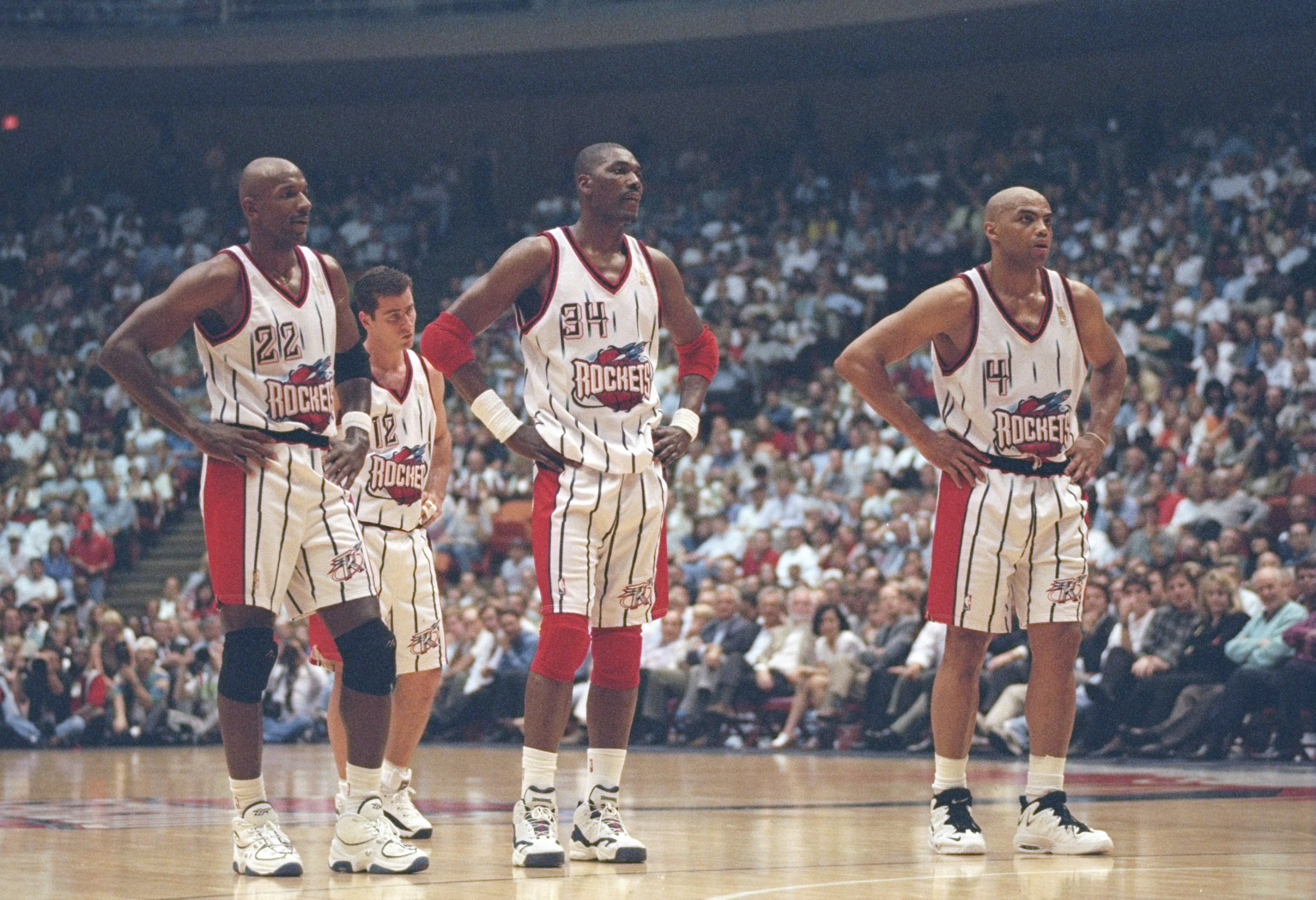 7 May 1997:  Center Hakeem Olajuwon, forward Clyde Drexler (left) and forward Charles Barkley of the Houston Rockets stands on the court during a playoff game against the Seattle Supersonics at the Summit in Houston, Texas.  The Supersonics won the game 1