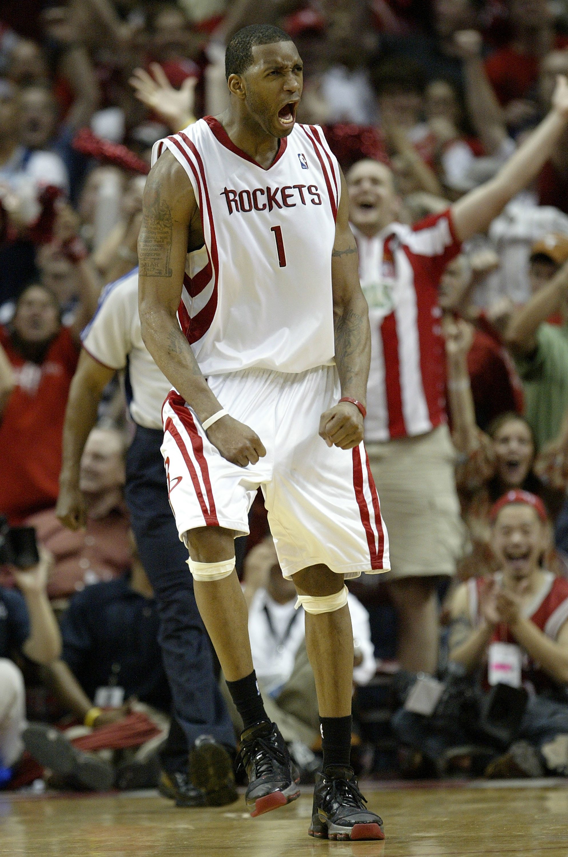 HOUSTON - MAY 5:  Forward Tracy McGrady #1 of the Houston Rockets reacts against the Utah Jazz in Game Seven of the Western Conference Quarterfinals during the 2007 NBA Playoffs at Toyota Center May 5, 2007 in Houston, Texas. NOTE TO USER: User expressly