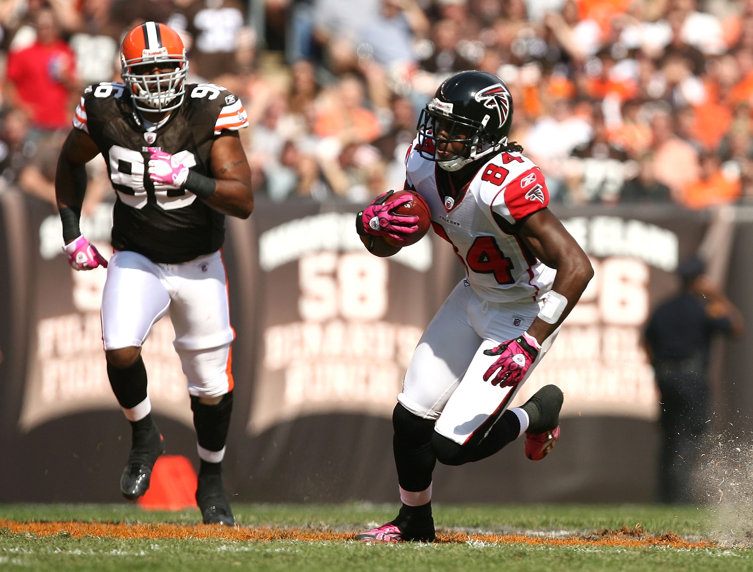 CLEVELAND - OCTOBER 10:  Wide receiver Roddy White #84 of the Atlanta Falcons runs from David Bowens #96 at Cleveland Browns Stadium on October 10, 2010 in Cleveland, Ohio.  (Photo by Matt Sullivan/Getty Images)
