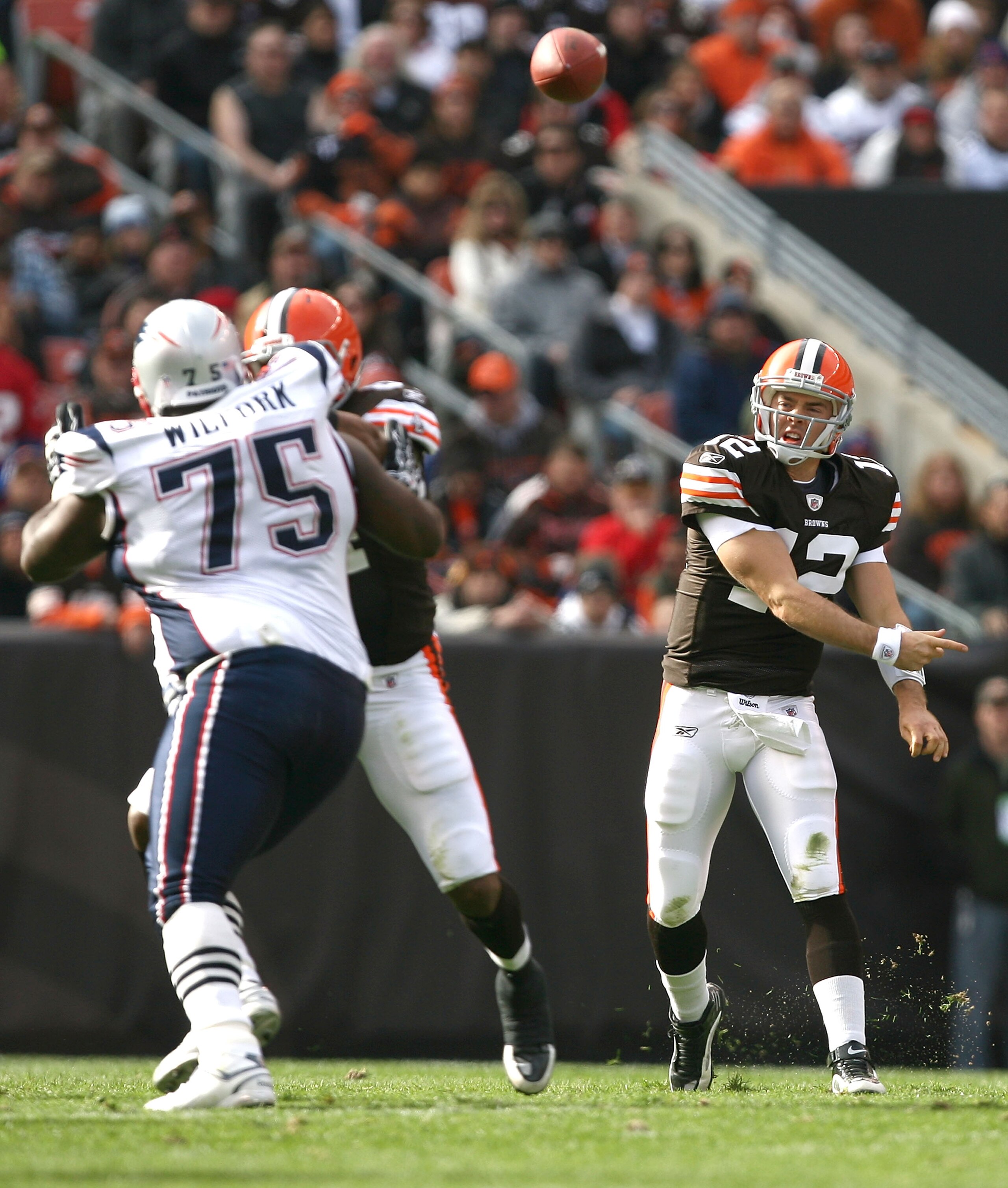 CLEVELAND - NOVEMBER 07:  Quarterback Colt McCoy #12 of the Cleveland Browns throws to a receiver against the New England Patriots at Cleveland Browns Stadium on November 7, 2010 in Cleveland, Ohio.  (Photo by Matt Sullivan/Getty Images)
