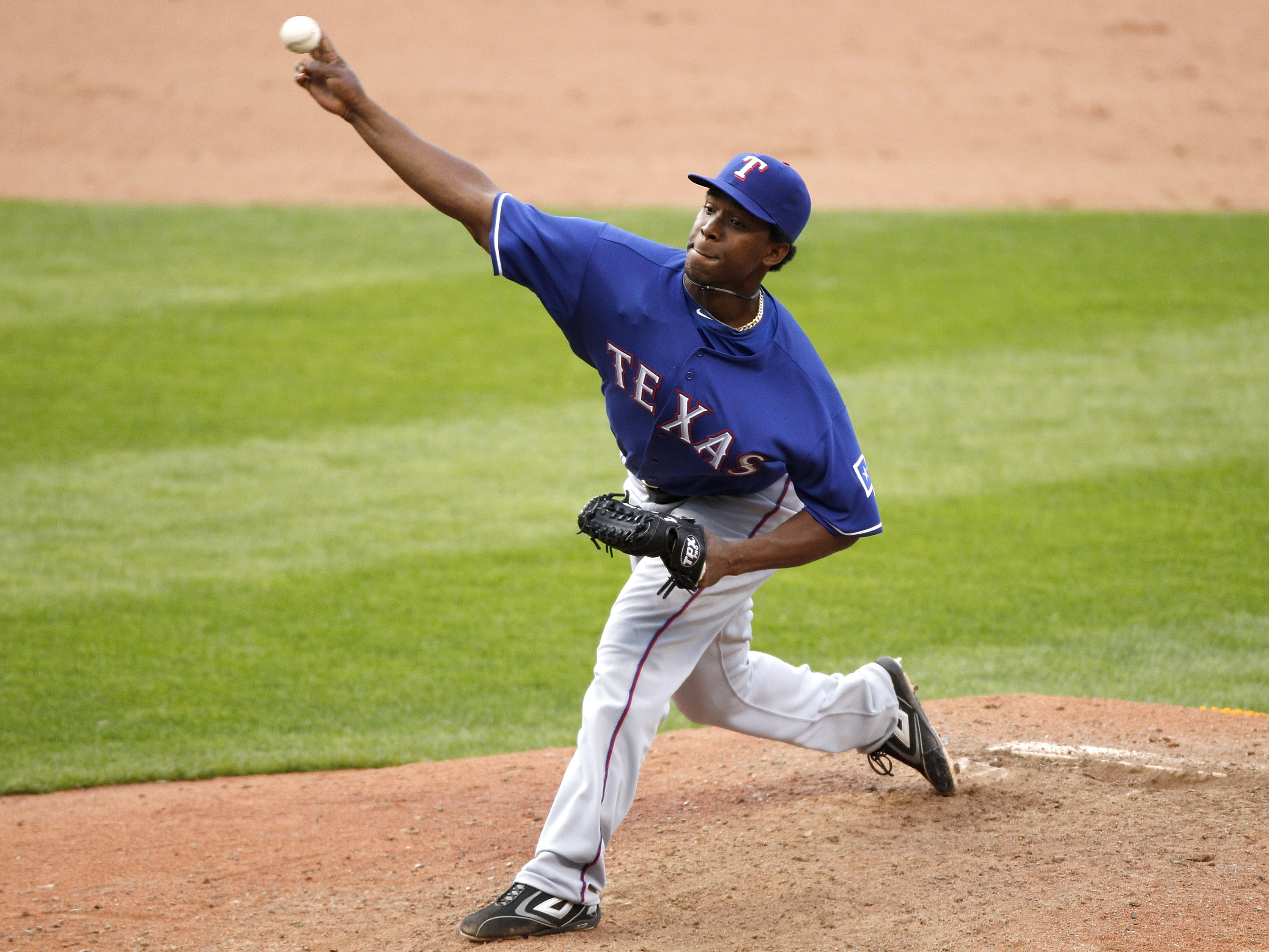CLEVELAND, OH - APRIL 12:  Neftali Perez #30 of the Texas Rangers throws a pitch in the 10th inning against the Cleveland Indians during Opening Day on April 12, 2010 at Progressive Field in Cleveland, Ohio. Texas won the game 4-2 in 10 innings.  (Photo b