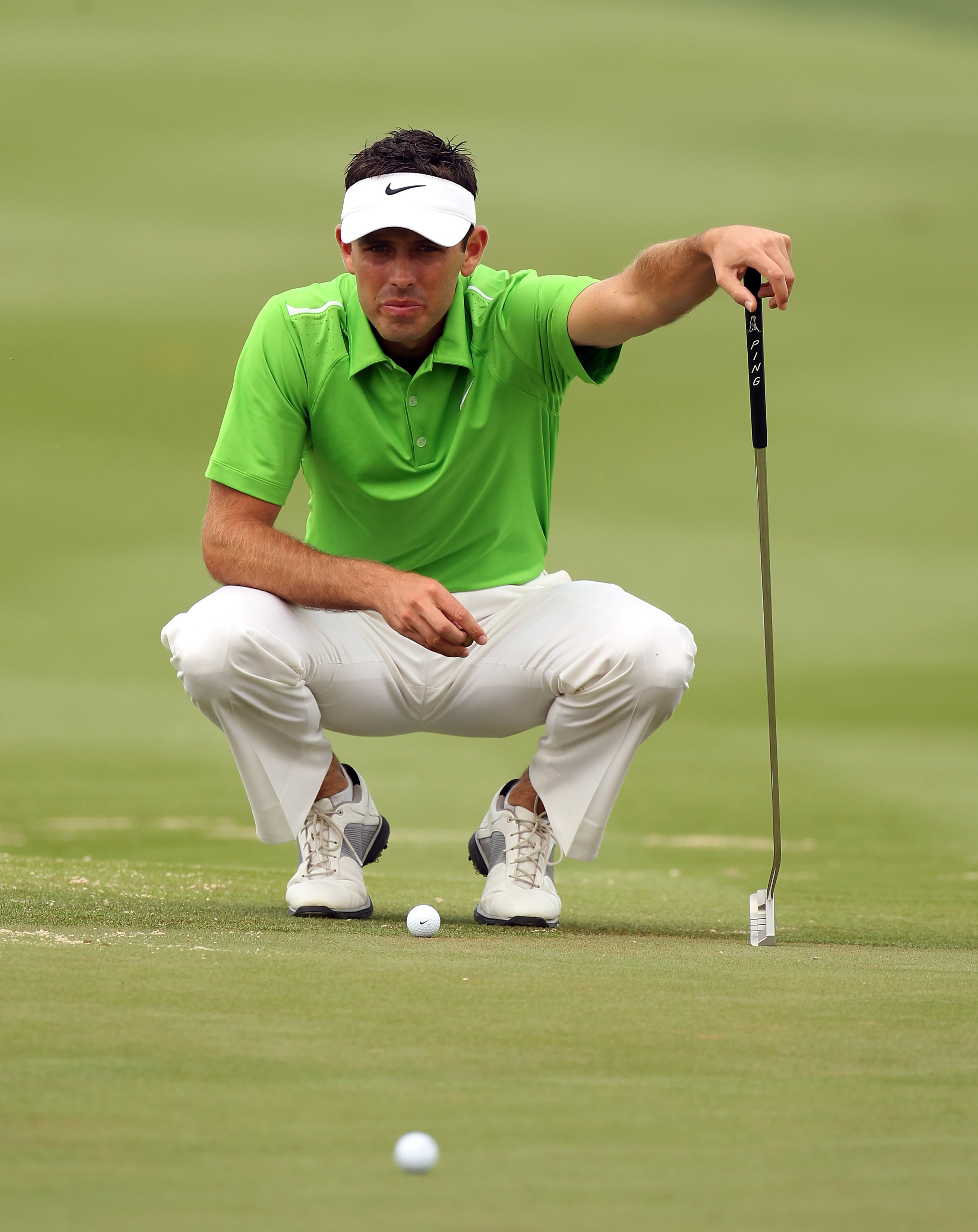 ABU DHABI, UNITED ARAB EMIRATES - JANUARY 22: Charl Schwartzel of South Africa checks the line of his putt during the third round of the Abu Dhabi HSBC Golf Championship at the Abu Dhabi Golf Club on January 22, 2011 in Abu Dhabi, United Arab Emirates.