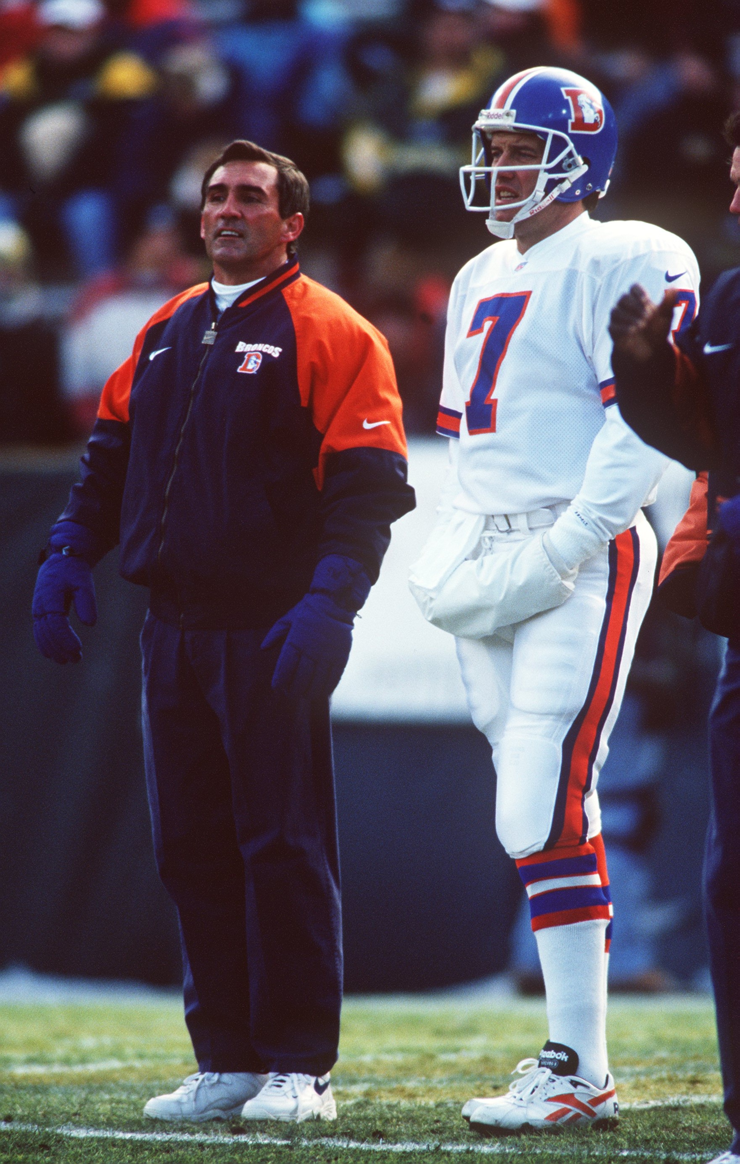 8 Dec 1996: Head coach Mike Shanahan (left) and Quarterback John Elway of the Denver Broncos stand on the sidelines during the Broncos 41-6 loss to the Green Bay Packers at Lambeau Field in Green Bay, Wisconsin.