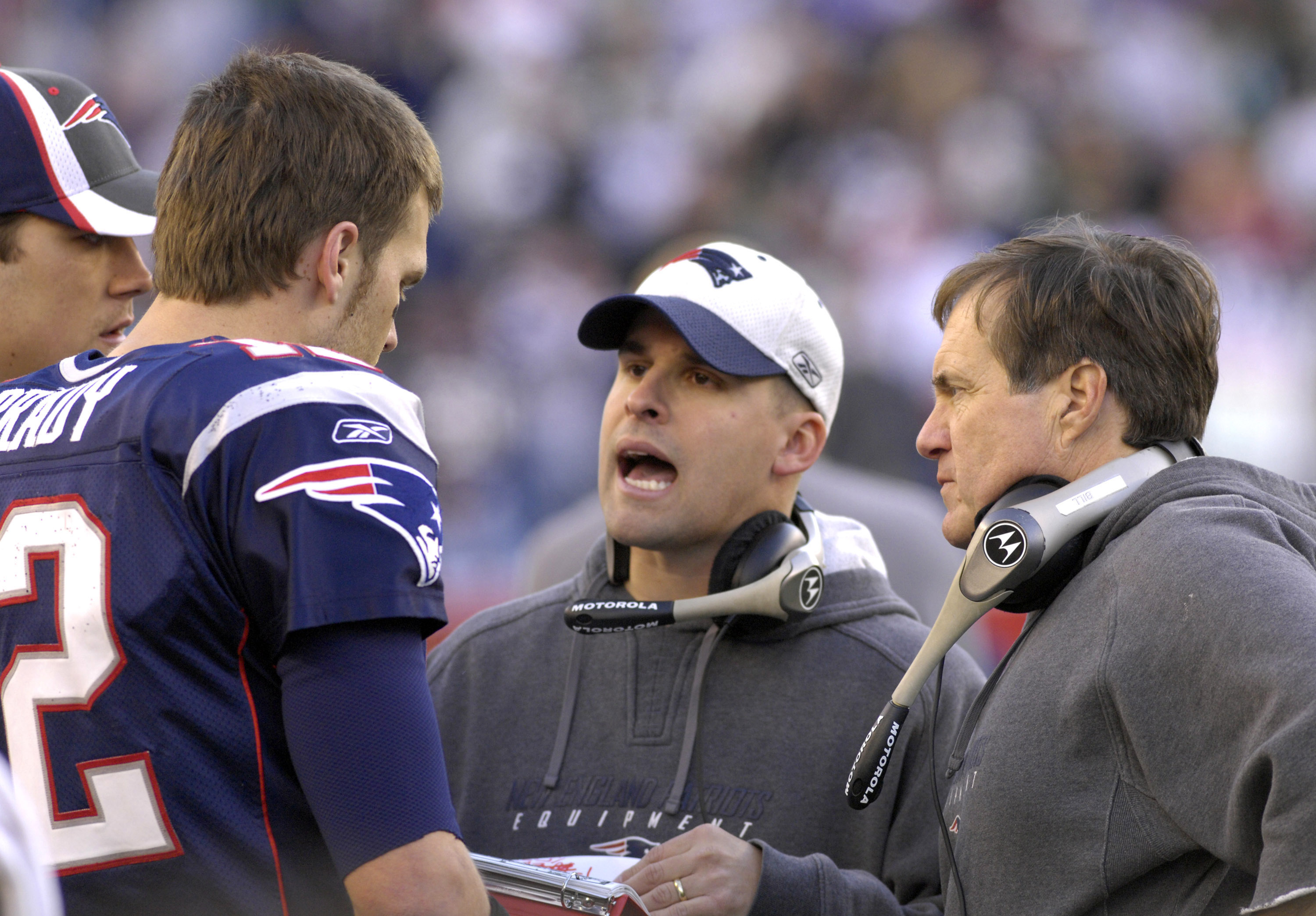 New England Patriots coach Bill Belichick (right) and Josh McDaniels (center) with quarterback Tom Brady   against the New York Jets in  an NFL wild card playoff game Jan. 7, 2007 in Foxborough.  The Pats won 37 - 16. (Photo by Al Messerschmidt/Getty Imag