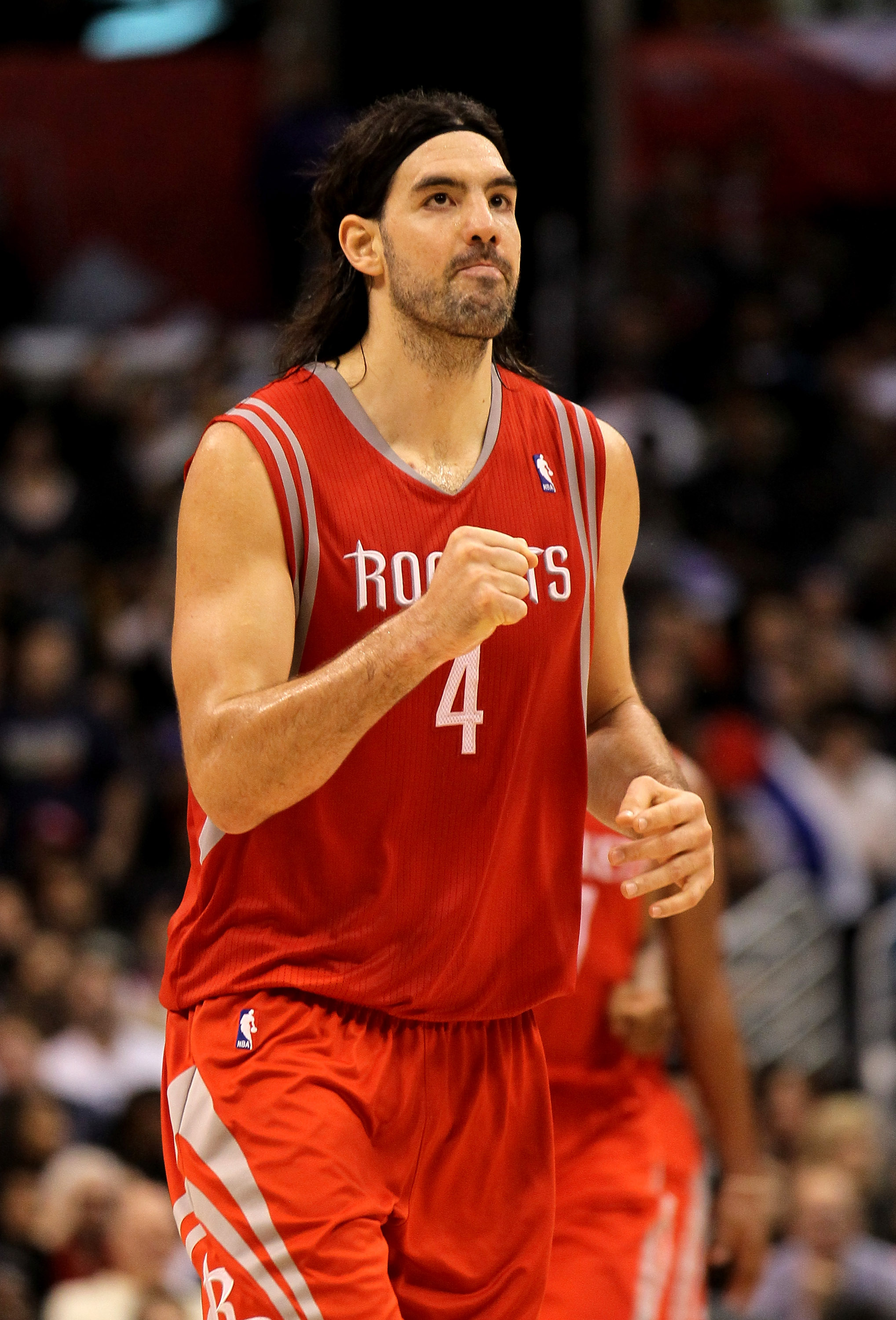 Houston Rockets' Tracy McGrady (1) reacts with teammate Luis Scola