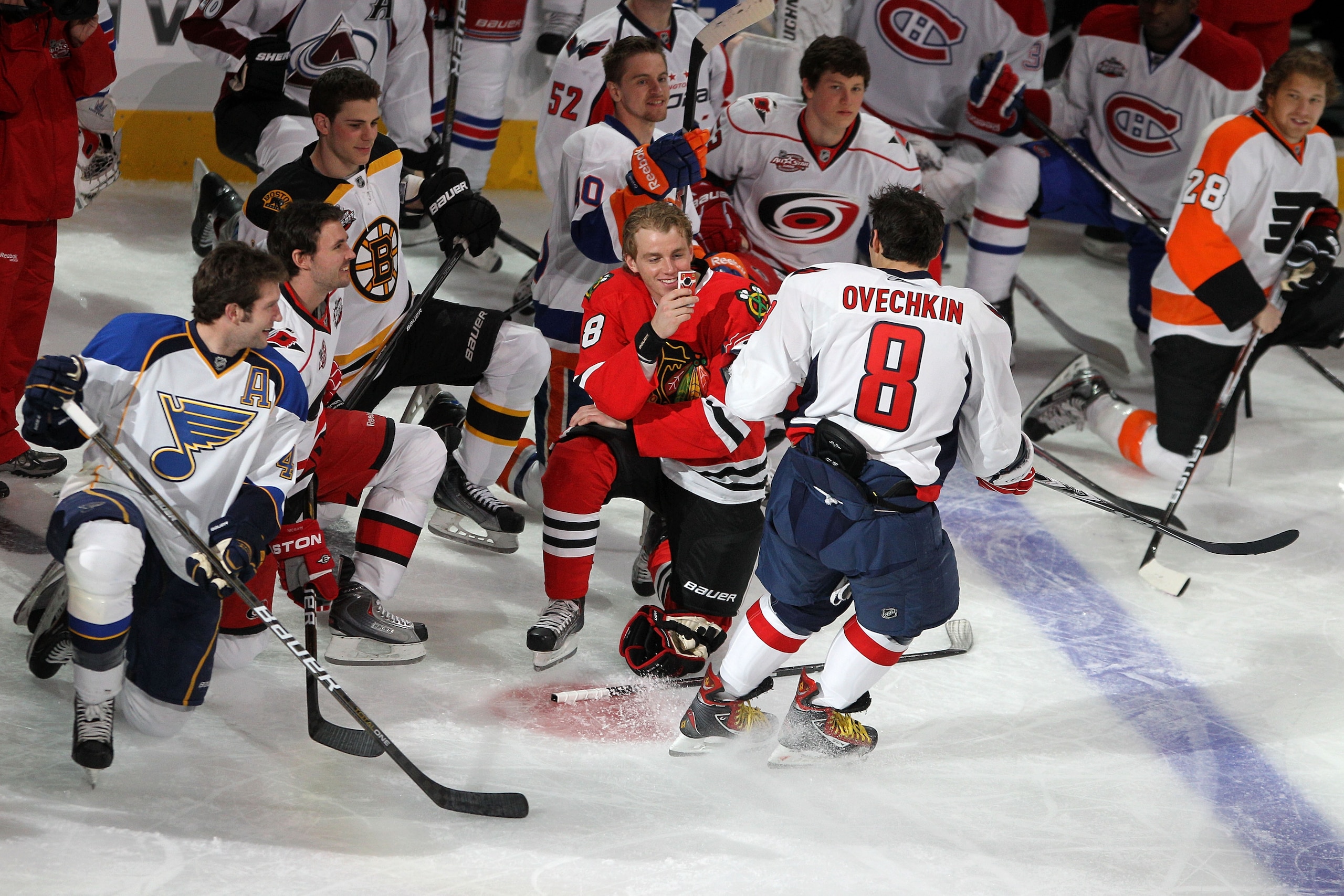 RALEIGH, NC - JANUARY 29:  Patrick Kane #88 of the Chicago Blackhawks takes a picture of Alexander Ovechkin #8 of the Washington Capitals as he skates by during the Honda NHL SuperSkills competition part of 2011 NHL All-Star Weekend at the RBC Center on J