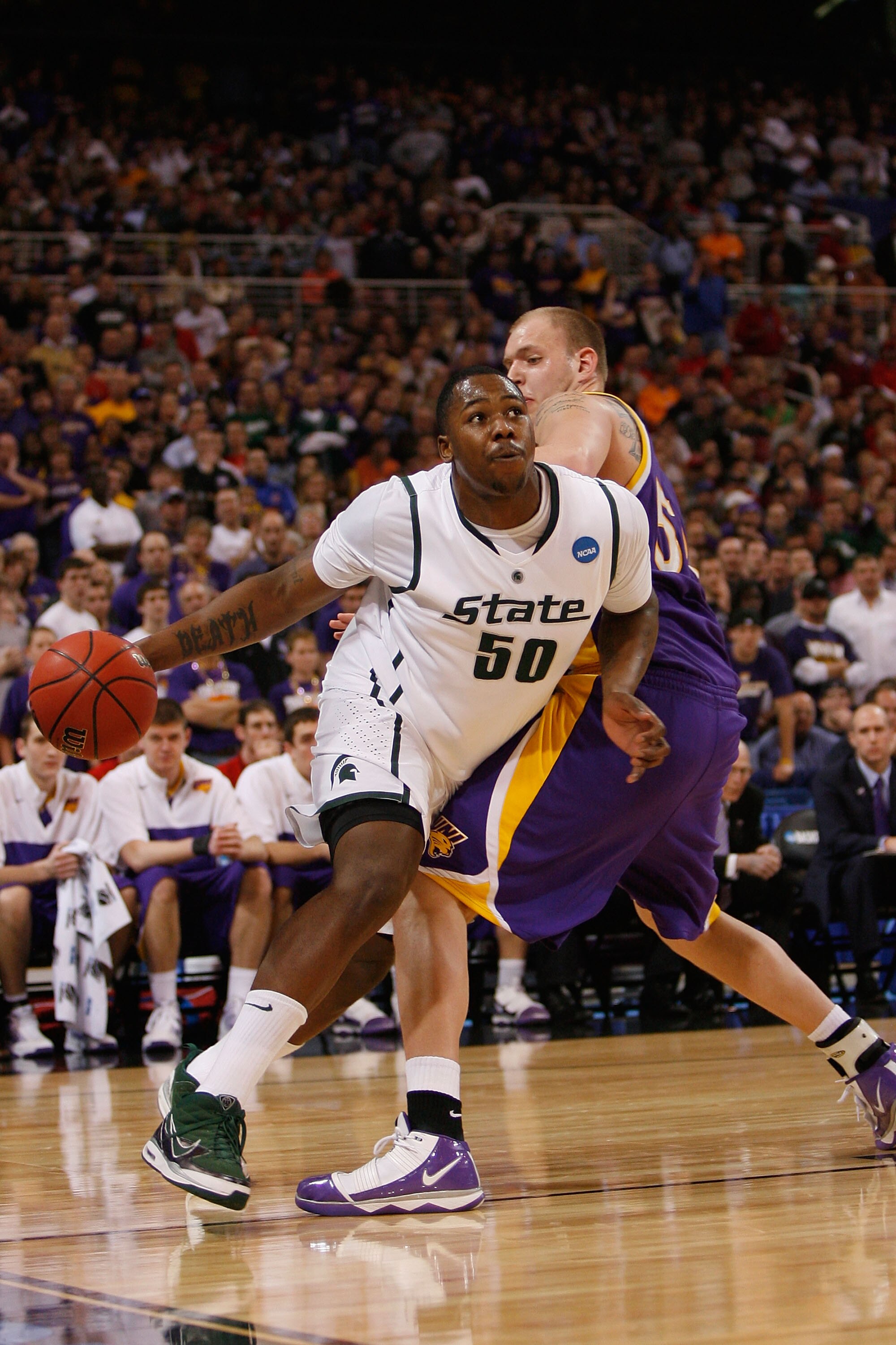 ST. LOUIS - MARCH 26: Derrick Nix #50 of the Michigan State Spartans looks to get past Jordan Eglseder #53 of the Northern Iowa Panthers during the midwest regional semifinal of the 2010 NCAA men's basketball tournament at the Edward Jones Dome on March 2