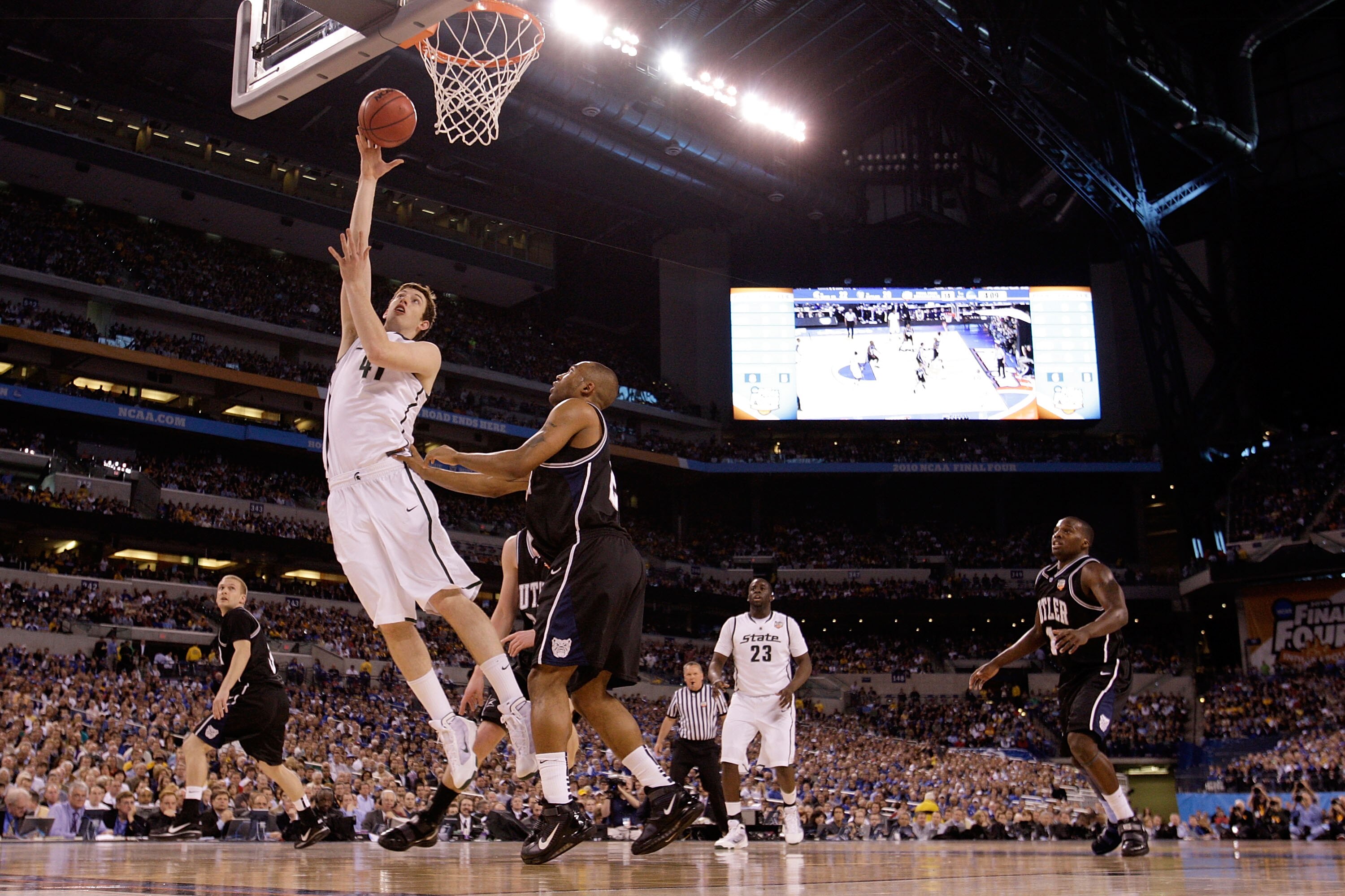INDIANAPOLIS - APRIL 03:  Garrick Sherman #41 of the Michigan State Spartans lays the ball up against Willie Veasley #21 of the Butler Bulldogs in the first half during the National Semifinal game of the 2010 NCAA Division I Men's Basketball Championship