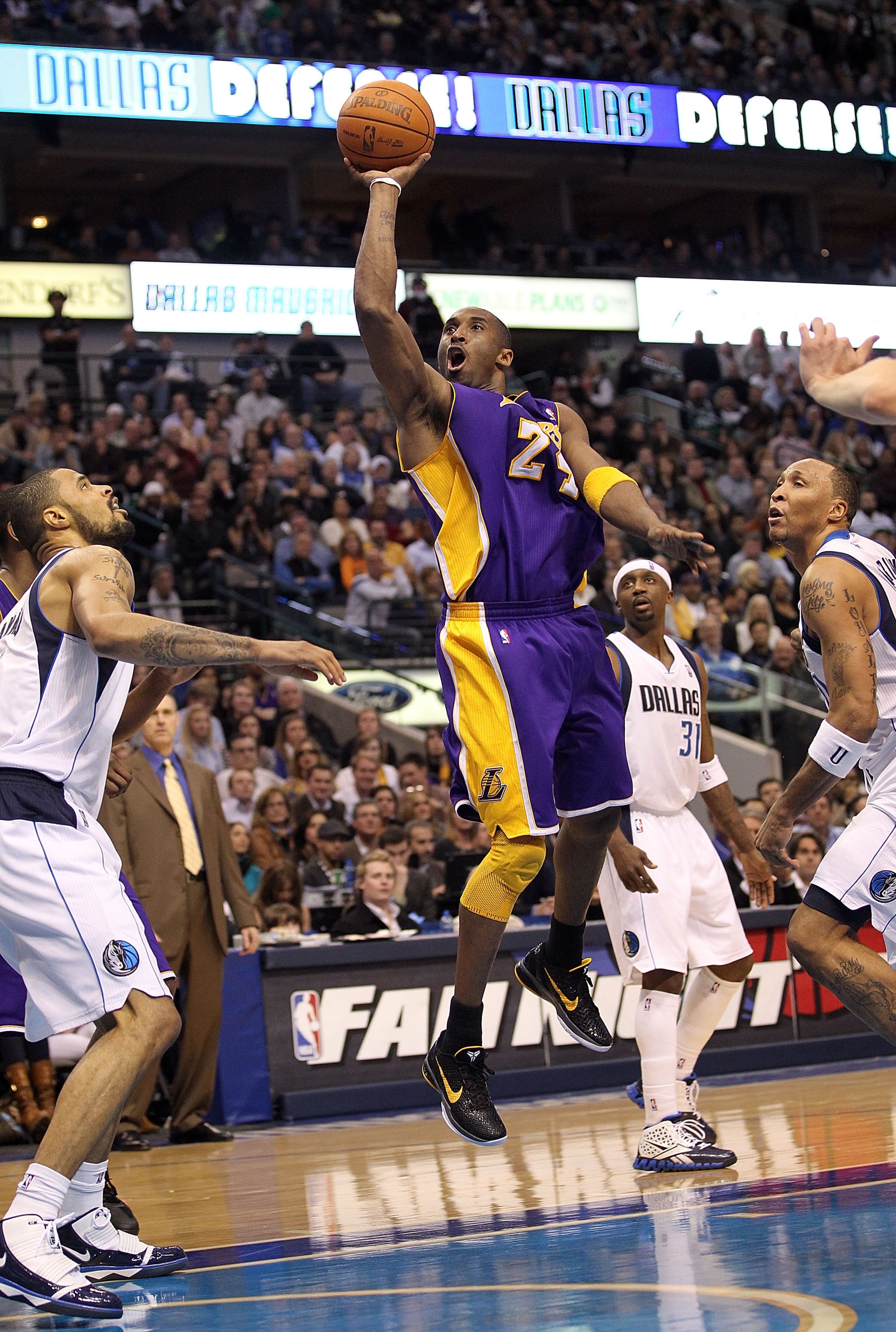 DALLAS, TX - JANUARY 19: Guard Kobe Bryant #24 of the Los Angeles Lakers takes a shot against the Dallas Mavericks at American Airlines Center on January 19, 2011 in Dallas, Texas. NOTE TO USER: User expressly acknowledges and agrees that, by downloadin DALLAS, TX - JANUARY 19: Guard Kobe Bryant #24 of the Los Angeles Lakers takes a shot against the Dallas Mavericks at American Airlines Center on January 19, 2011 in Dallas, Texas. NOTE TO USER: User expressly acknowledges and agrees that, by downloadin