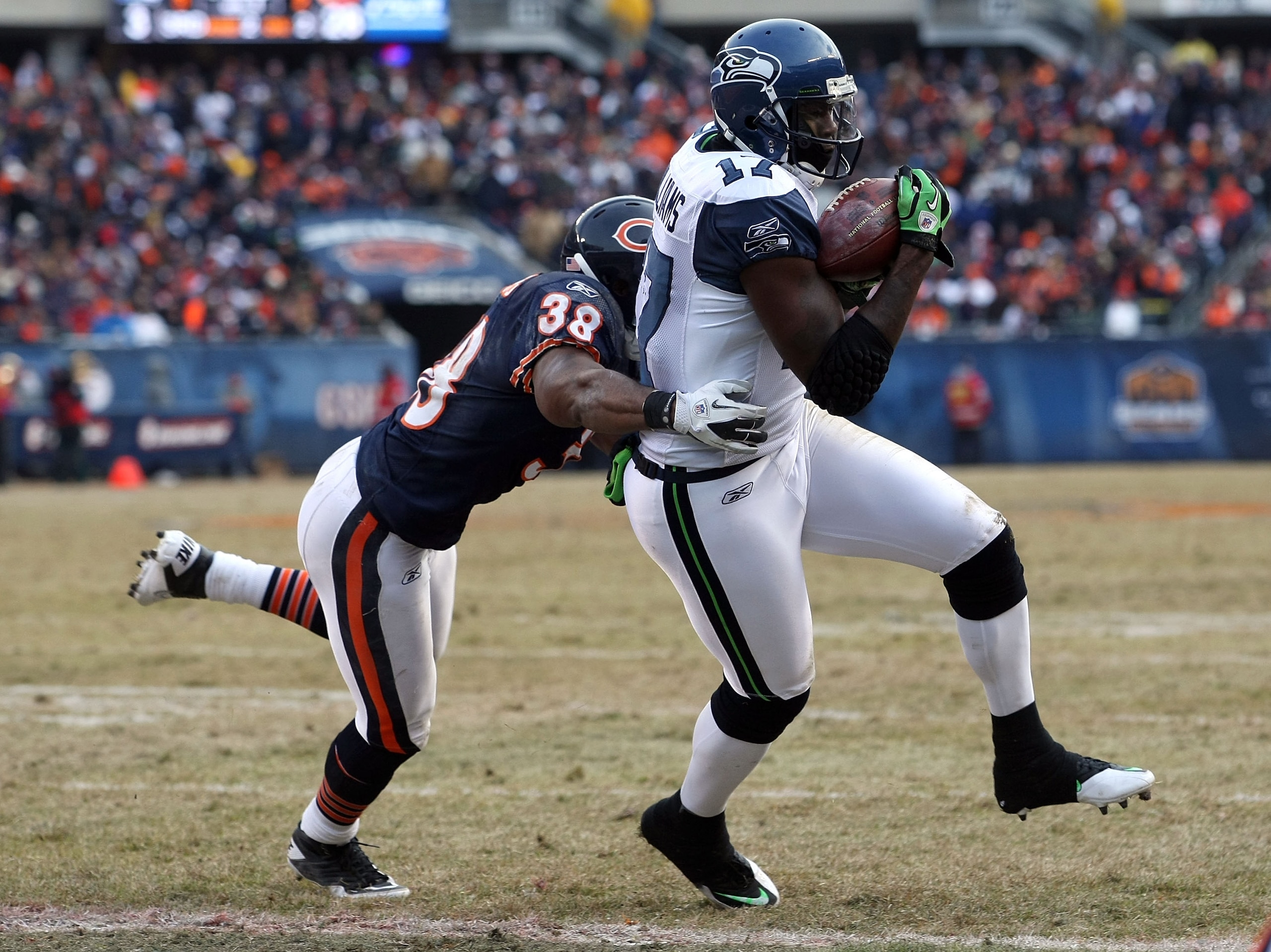 CHICAGO, IL - JANUARY 16: Wide receiver Mike Williams #17 of the Seattle Seahawks catches a two-yard touchdown against Danieal Manning #38 of the Chicago Bears in the fourth quarter of the 2011 NFC divisional playoff game at Soldier Field on January 16, CHICAGO, IL - JANUARY 16: Wide receiver Mike Williams #17 of the Seattle Seahawks catches a two-yard touchdown against Danieal Manning #38 of the Chicago Bears in the fourth quarter of the 2011 NFC divisional playoff game at Soldier Field on January 16,