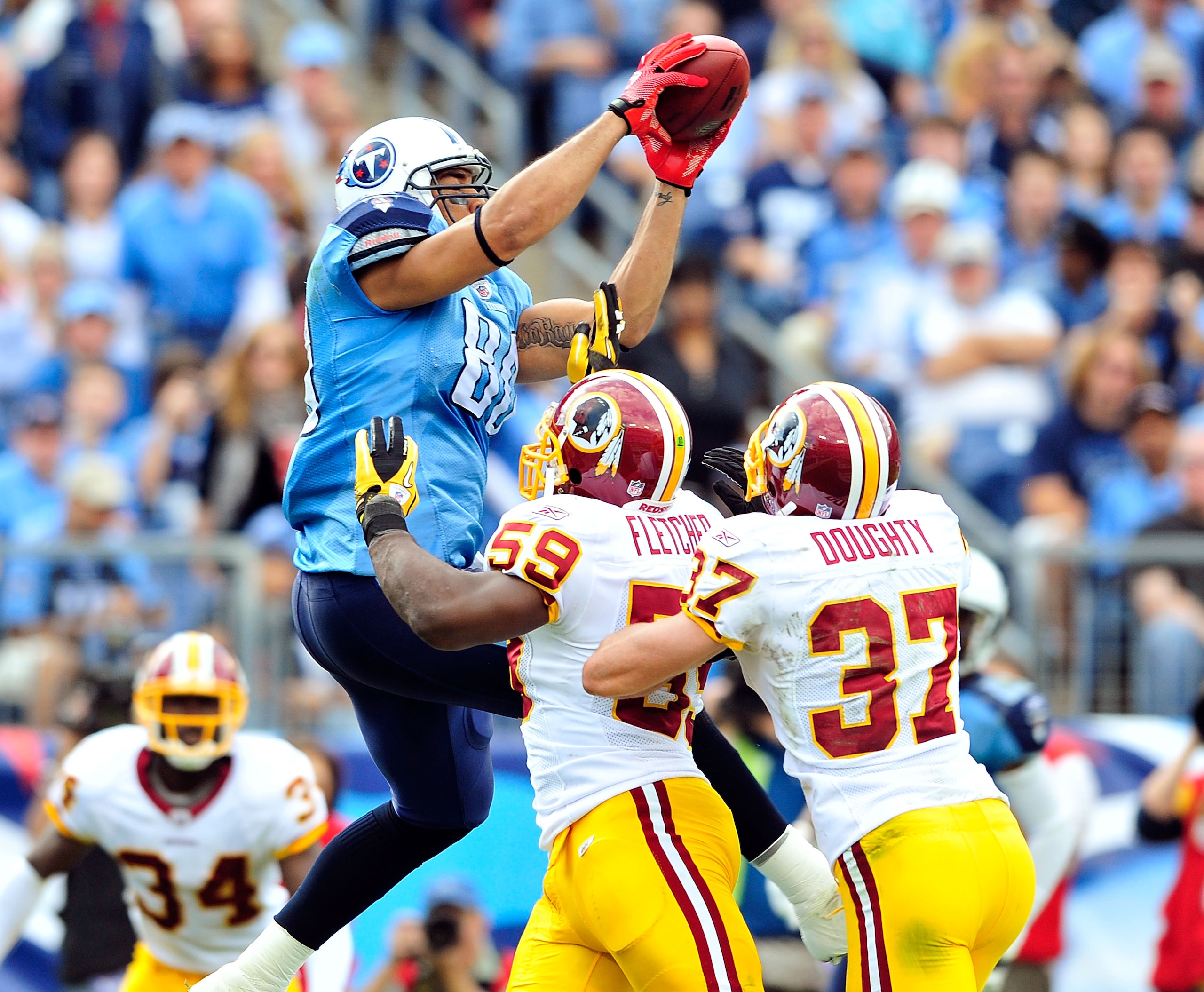 NASHVILLE, TN - NOVEMBER 21: London Fletcher #59 and Reed Doughty #37 of the Washington Redskins force Bo Scaife #80 of the Tennessee Titans out of the end zone to prevent a touchdown at LP Field on November 21, 2010 in Nashville, Tennessee. The Redskins NASHVILLE, TN - NOVEMBER 21: London Fletcher #59 and Reed Doughty #37 of the Washington Redskins force Bo Scaife #80 of the Tennessee Titans out of the end zone to prevent a touchdown at LP Field on November 21, 2010 in Nashville, Tennessee. The Redskins