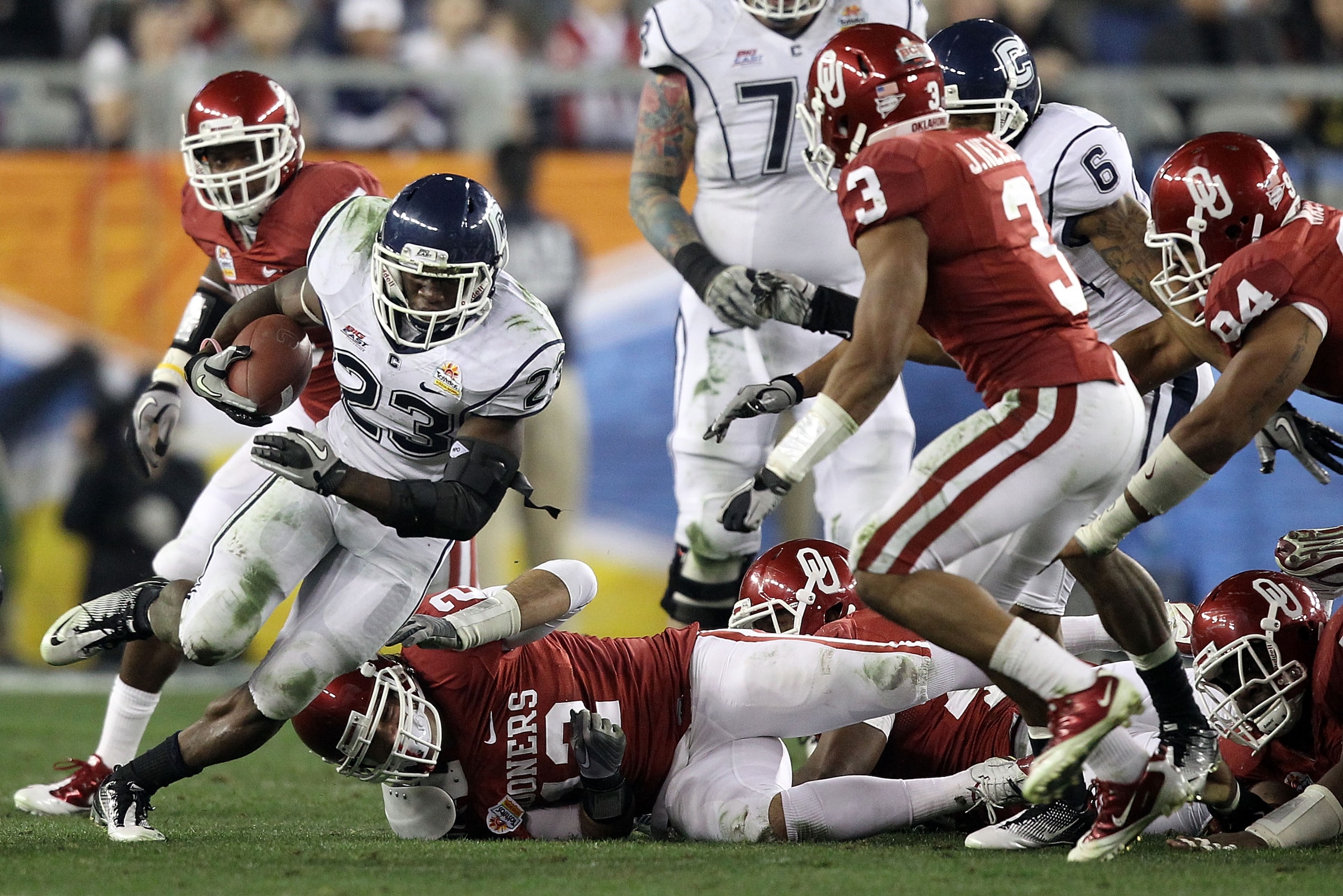 GLENDALE, AZ - JANUARY 01:  Jordan Todman #23 of the Connecticut Huskies runs the ball during the Tostitos Fiesta Bowl at the Universtity of Phoenix Stadium on January 1, 2011 in Glendale, Arizona.  (Photo by Christian Petersen/Getty Images)