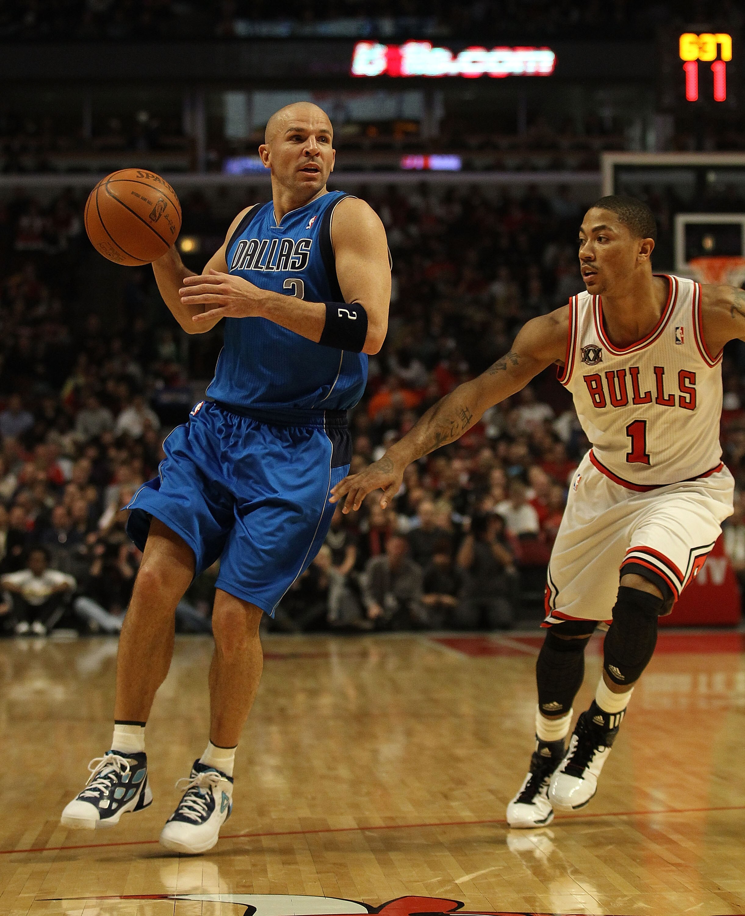 CHICAGO, IL - JANUARY 20: Jason Kidd #2 of the Dallas Mavericks looks to pass under pressure from Derrick Rose #1 of the Chicago Bulls at the United Center on January 20, 2011 in Chicago, Illinois. The Bulls defeated the Mavericks 82-77. NOTE TO USER: Use