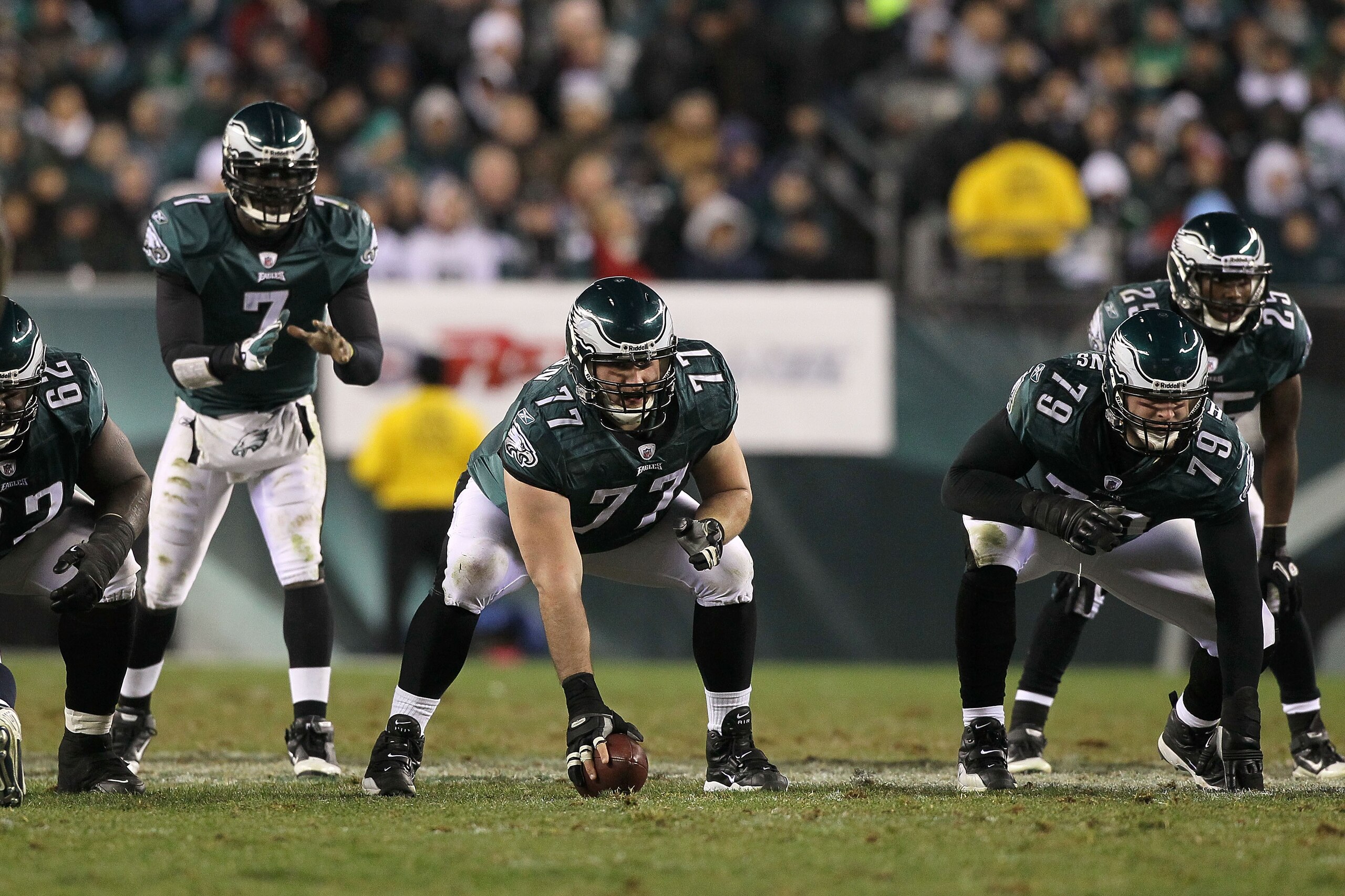 PHILADELPHIA, PA - DECEMBER 02: Mike McGlynn #77 of the Philadelphia Eagles gets set to snap the ball to quarterback Michael Vick #7 in the shotgun formation against the Houston Texans at Lincoln Financial Field on December 2, 2010 in Philadelphia, Penns PHILADELPHIA, PA - DECEMBER 02: Mike McGlynn #77 of the Philadelphia Eagles gets set to snap the ball to quarterback Michael Vick #7 in the shotgun formation against the Houston Texans at Lincoln Financial Field on December 2, 2010 in Philadelphia, Penns