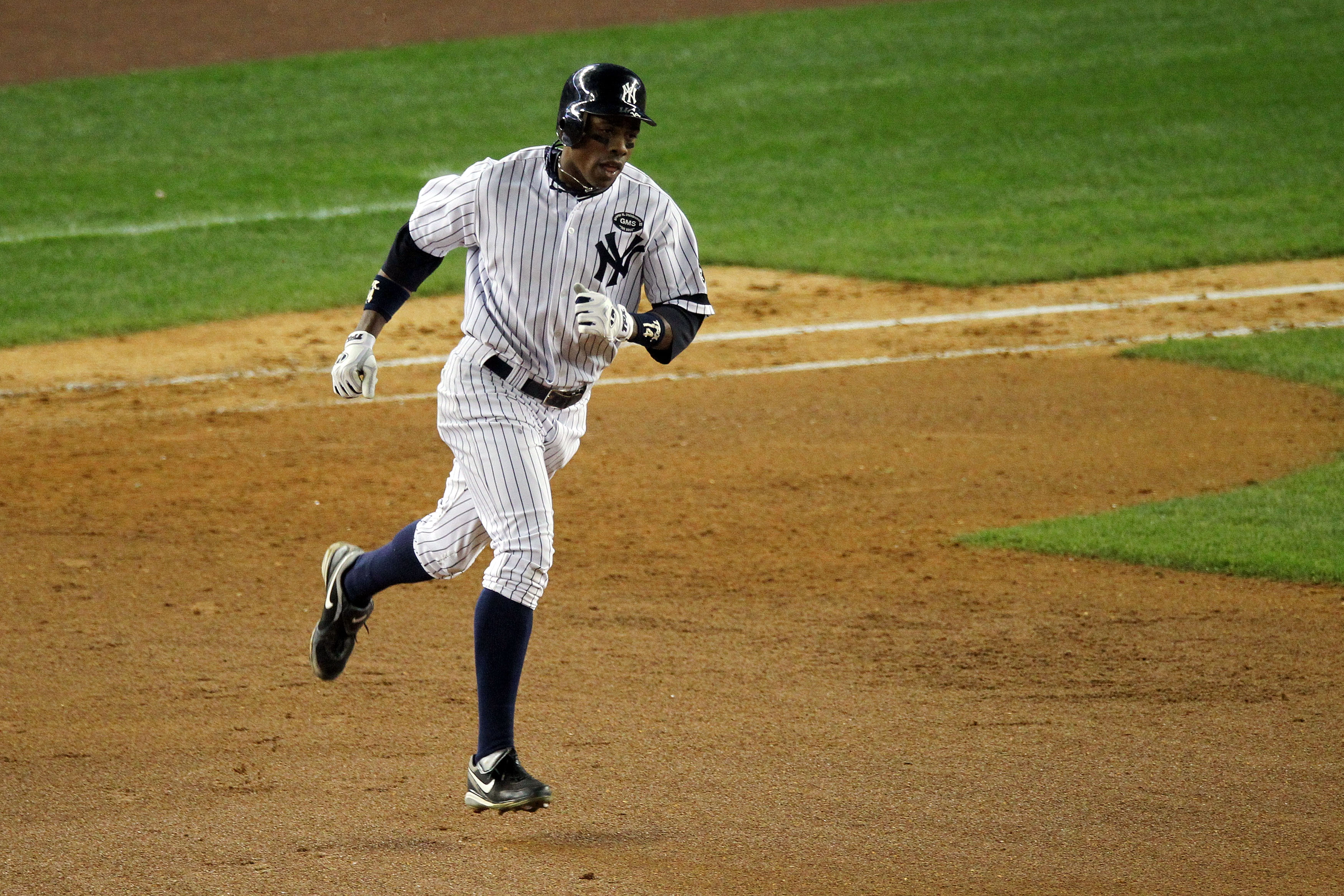 NEW YORK - OCTOBER 20:  Curtis Granderson #14 of the New York Yankees runs the bases on his solo home run in the bottom of the eighth inning against the Texas Rangers in Game Five of the ALCS during the 2010 MLB Playoffs at Yankee Stadium on October 20, 2