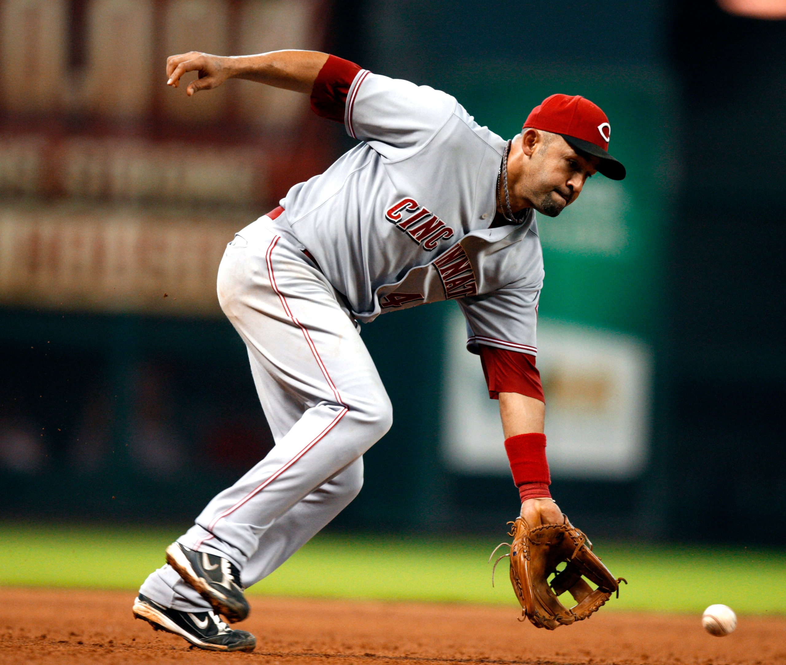 HOUSTON - SEPTEMBER 19:  Third baseman Miguel Cairo #43 of the Cincinnatti Reds fields a ground ball against the Houston Astros at Minute Maid Park on September 19, 2010 in Houston, Texas.  (Photo by Bob Levey/Getty Images)