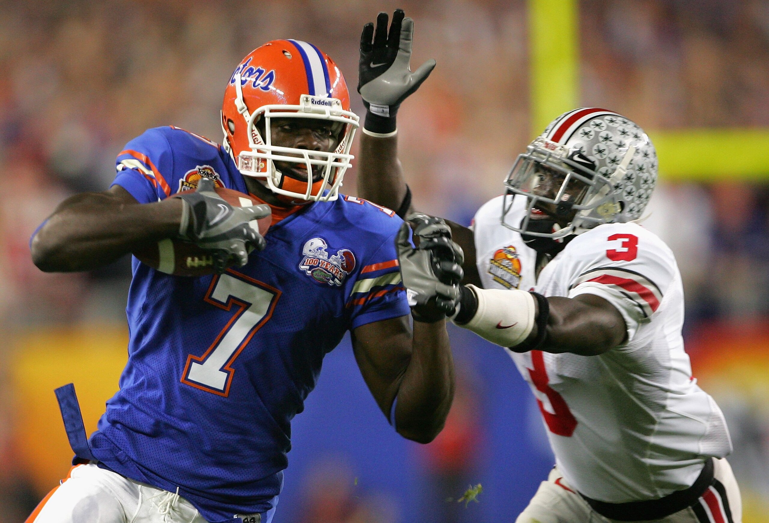 GLENDALE, AZ - JANUARY 08: Wide receiver Cornelius Ingram #7 of the Florida Gators carries the ball under pressure from Jamario O'Neal #3 of the Ohio State Buckeyes during the 2007 Tostitos BCS National Championship Game at the University of Phoenix Stad GLENDALE, AZ - JANUARY 08: Wide receiver Cornelius Ingram #7 of the Florida Gators carries the ball under pressure from Jamario O'Neal #3 of the Ohio State Buckeyes during the 2007 Tostitos BCS National Championship Game at the University of Phoenix Stad