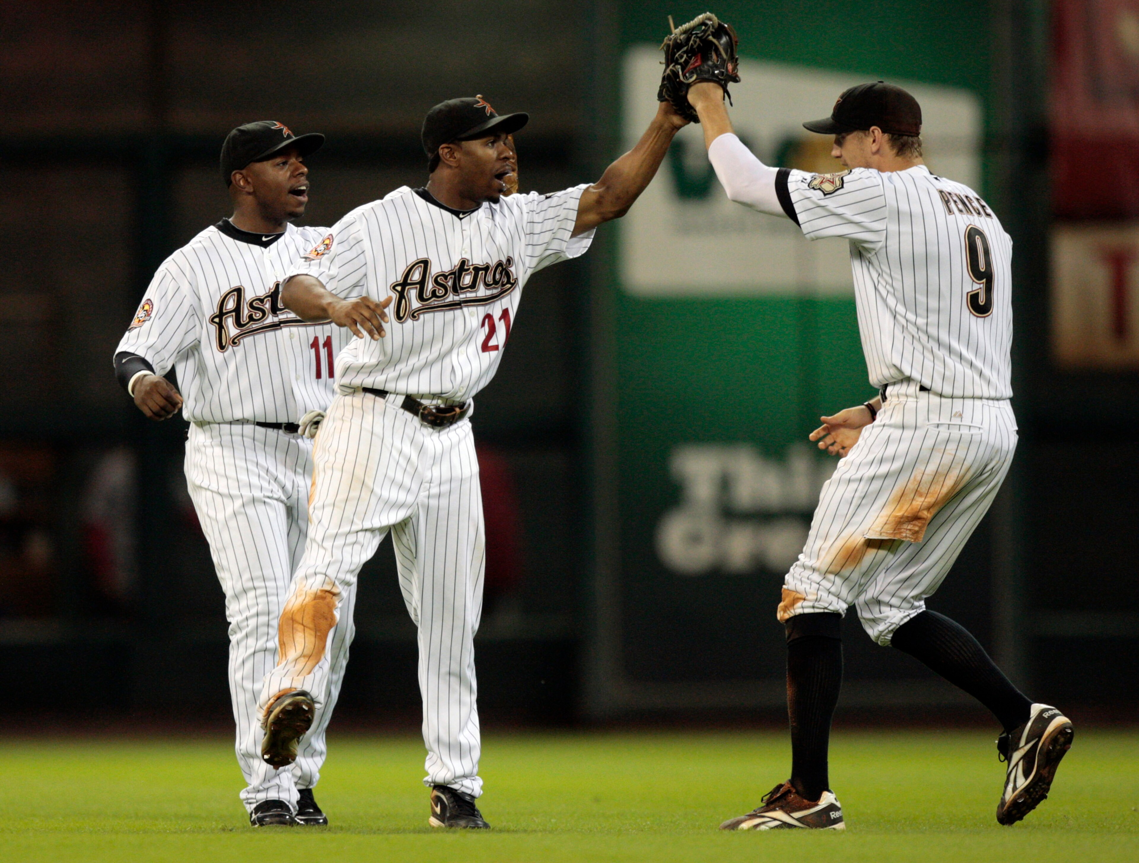 HOUSTON - AUGUST 31: Center fielder Michael Bourn #21 and Jason Bourgeois #11 of the Houston Astros congratulate teammate Hunter Pence #9 after they defeated the St. Louis Cardinals 3-0 at Minute Maid Park on August 31, 2010 in Houston, Texas. (Photo by HOUSTON - AUGUST 31: Center fielder Michael Bourn #21 and Jason Bourgeois #11 of the Houston Astros congratulate teammate Hunter Pence #9 after they defeated the St. Louis Cardinals 3-0 at Minute Maid Park on August 31, 2010 in Houston, Texas. (Photo by
