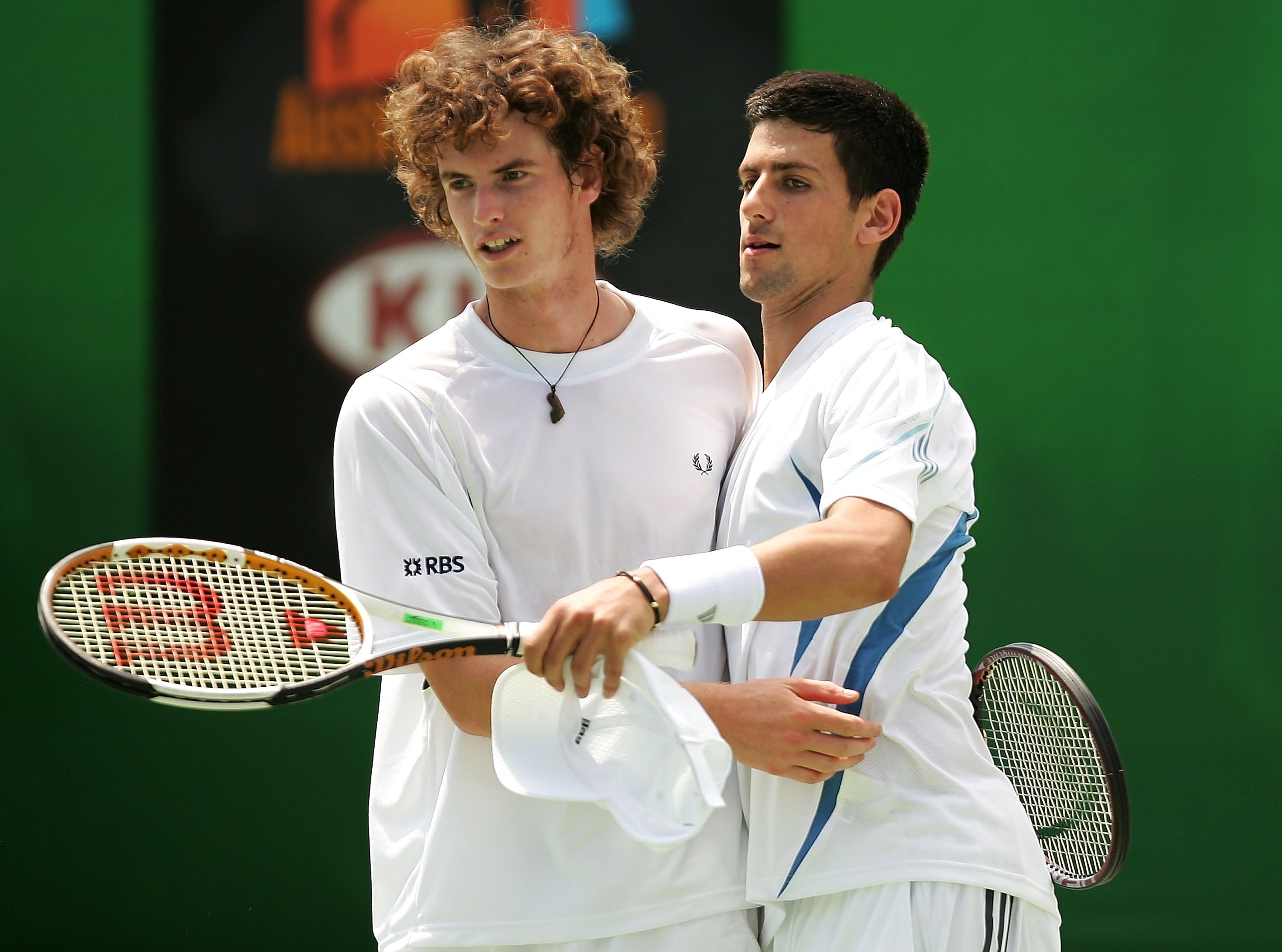 MELBOURNE, AUSTRALIA - JANUARY 19: Andy Murray of Great Britain and Novak Djokovic of Serbia and Montenegro celebrate a point in their doubles match against Fabrice Santoro of France and Nenad Zimonjic of Serbia and Montenegro during day four of the Austr